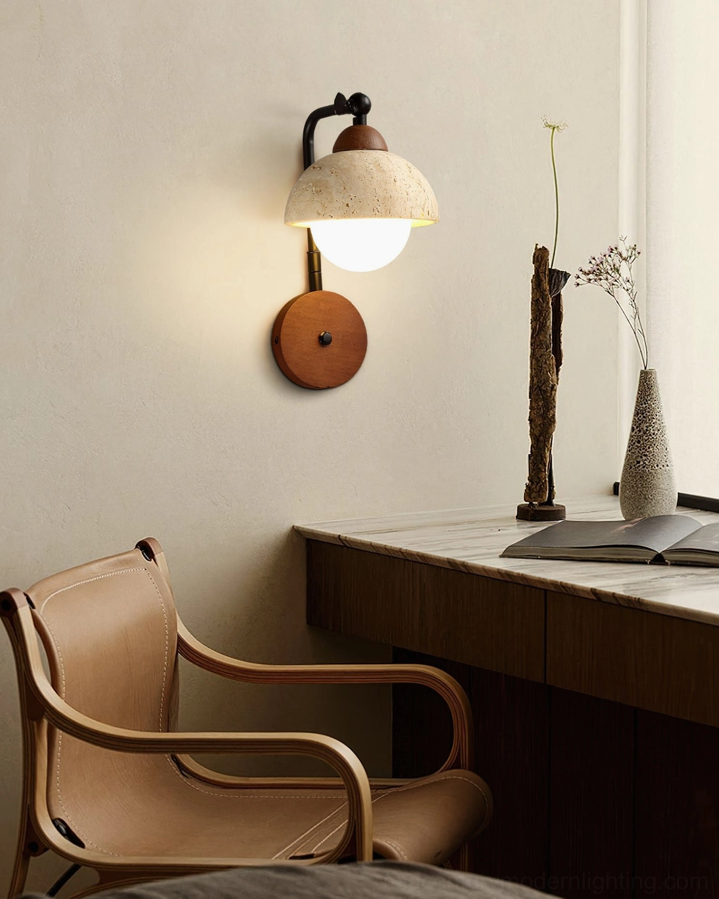 Kell travertine wall lamp installed in home study desk corner, warm neutral rustic interior design setting