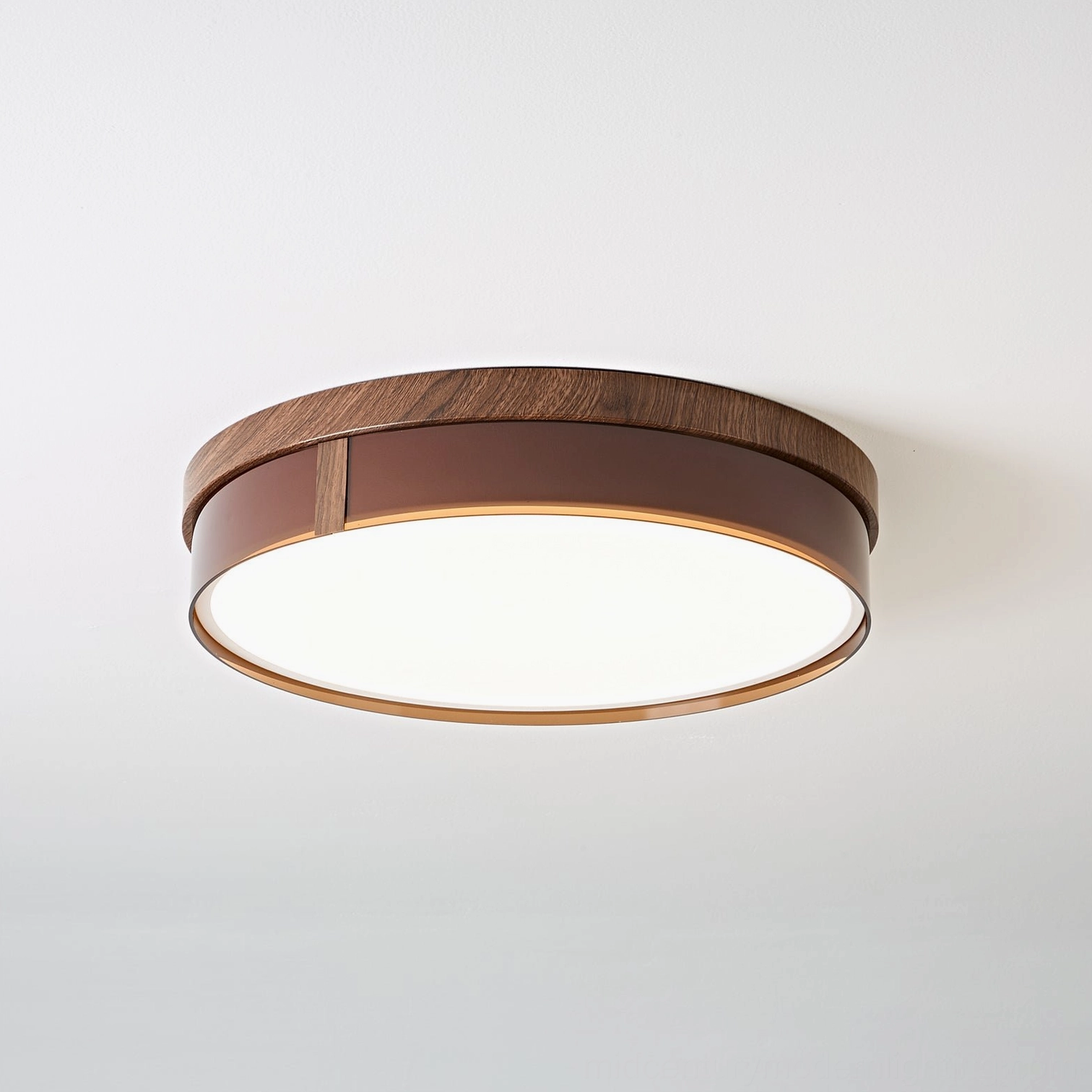 Kelsey round flush mount ceiling light illuminated, warm light diffuser panel with wood-grain frame glowing overhead view