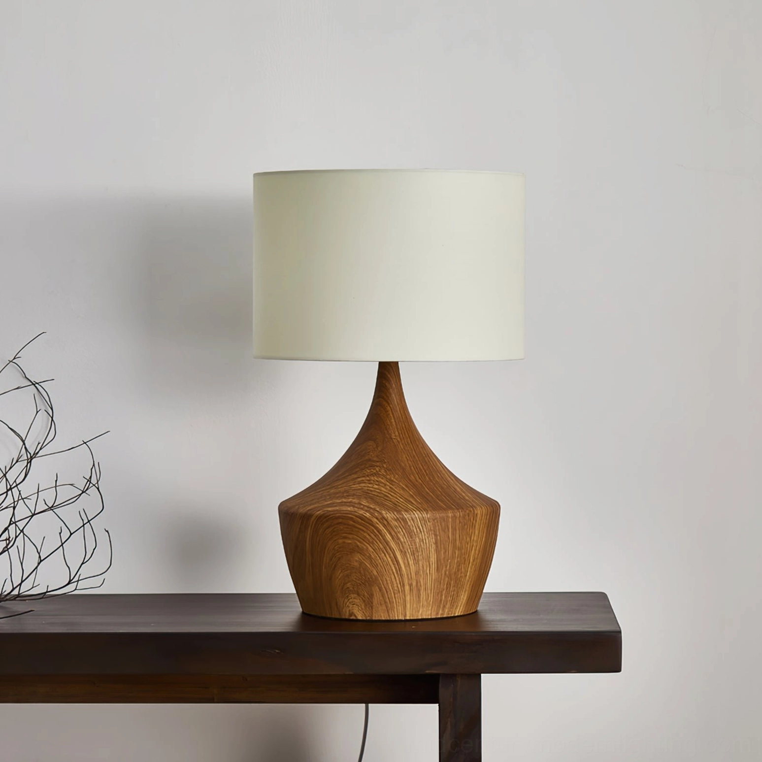 Kendra walnut table lamp on console with dried flower decorations and minimalist styling