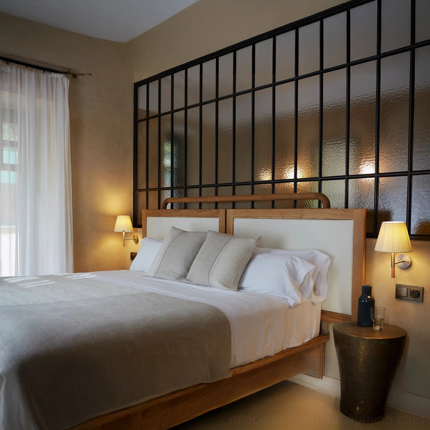 Pair of Kilkee wall lamps flanking bed in industrial modern bedroom design