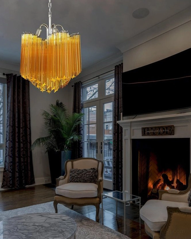 Kite amber glass chandelier in formal living room with fireplace ambiance