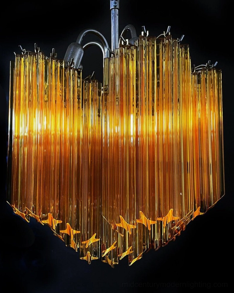 Close-up detail of kite amber glass prism chandelier star-shaped design
