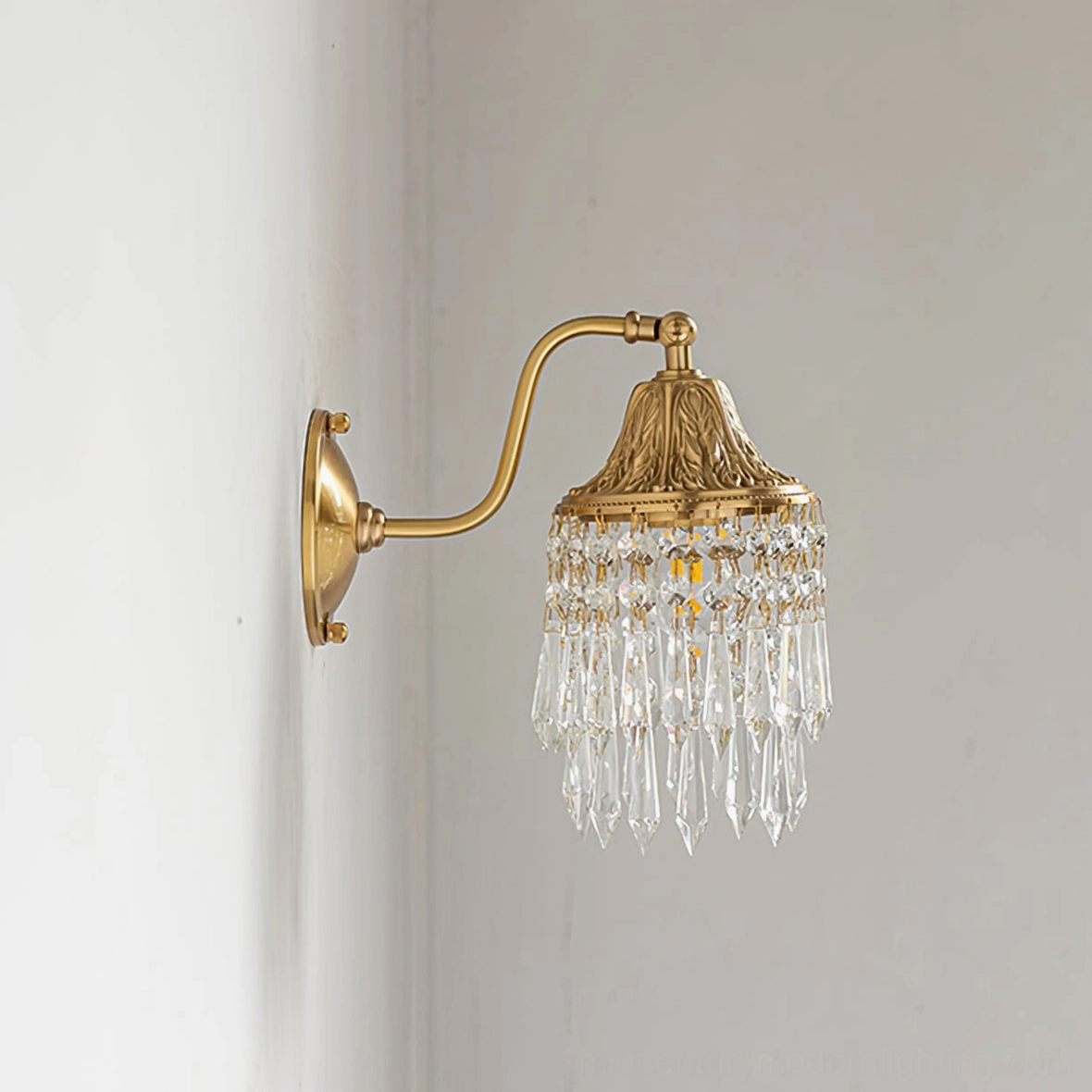 Kristall crystal wall lamp right corner angle displaying brass curved arm and crystal pendant arrangement