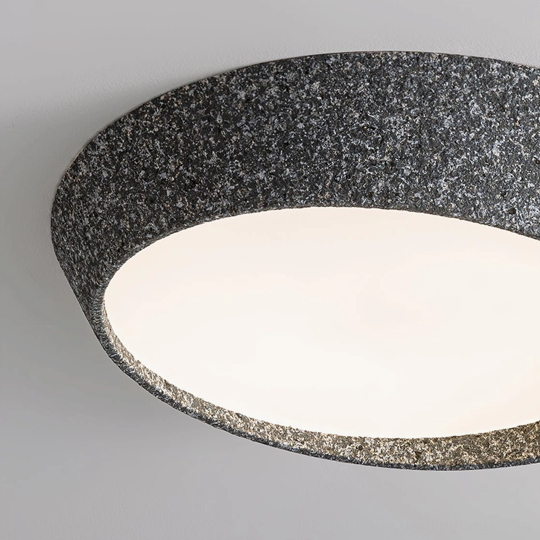 Kuzco textured ceiling lamp side profile showing sculptural form