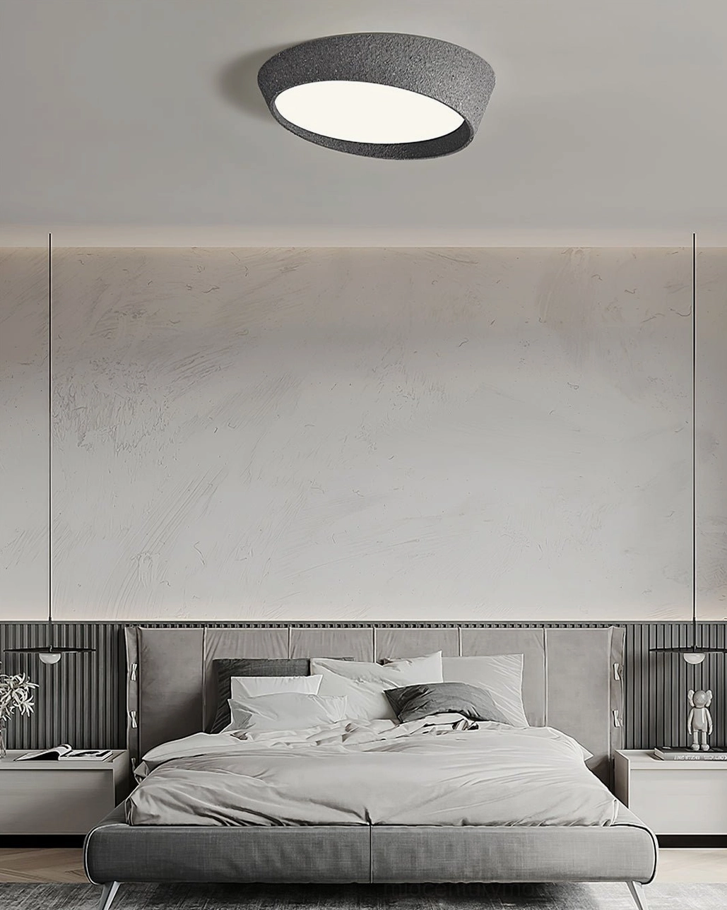 Light gray Kuzco ceiling lamp in luxury wabi-sabi style bedroom with concrete walls