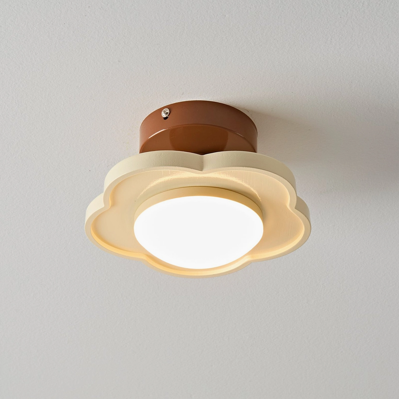Laguna beige ceiling lamp lit with warm light, cozy home lighting solution with layered design