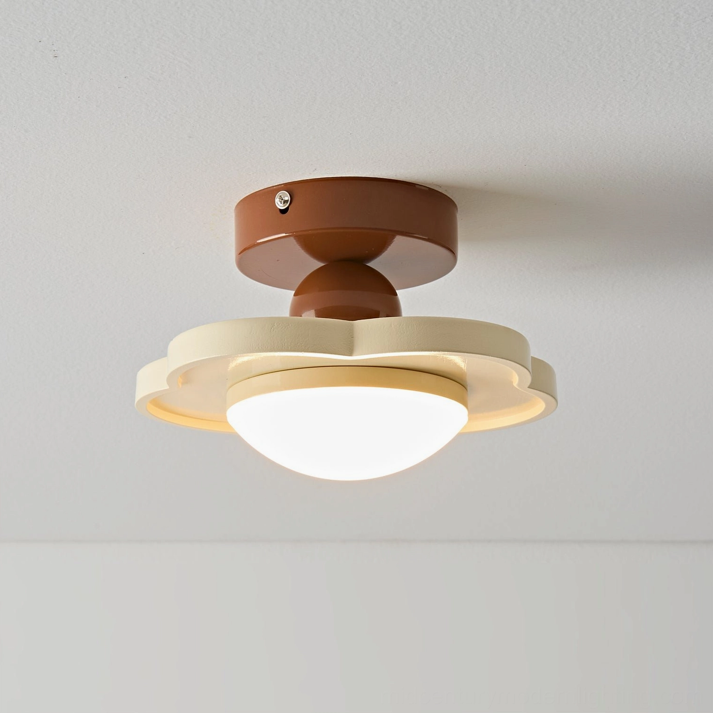 Laguna mid-century modern flush mount ceiling lamp creating warm ambient light in home interior