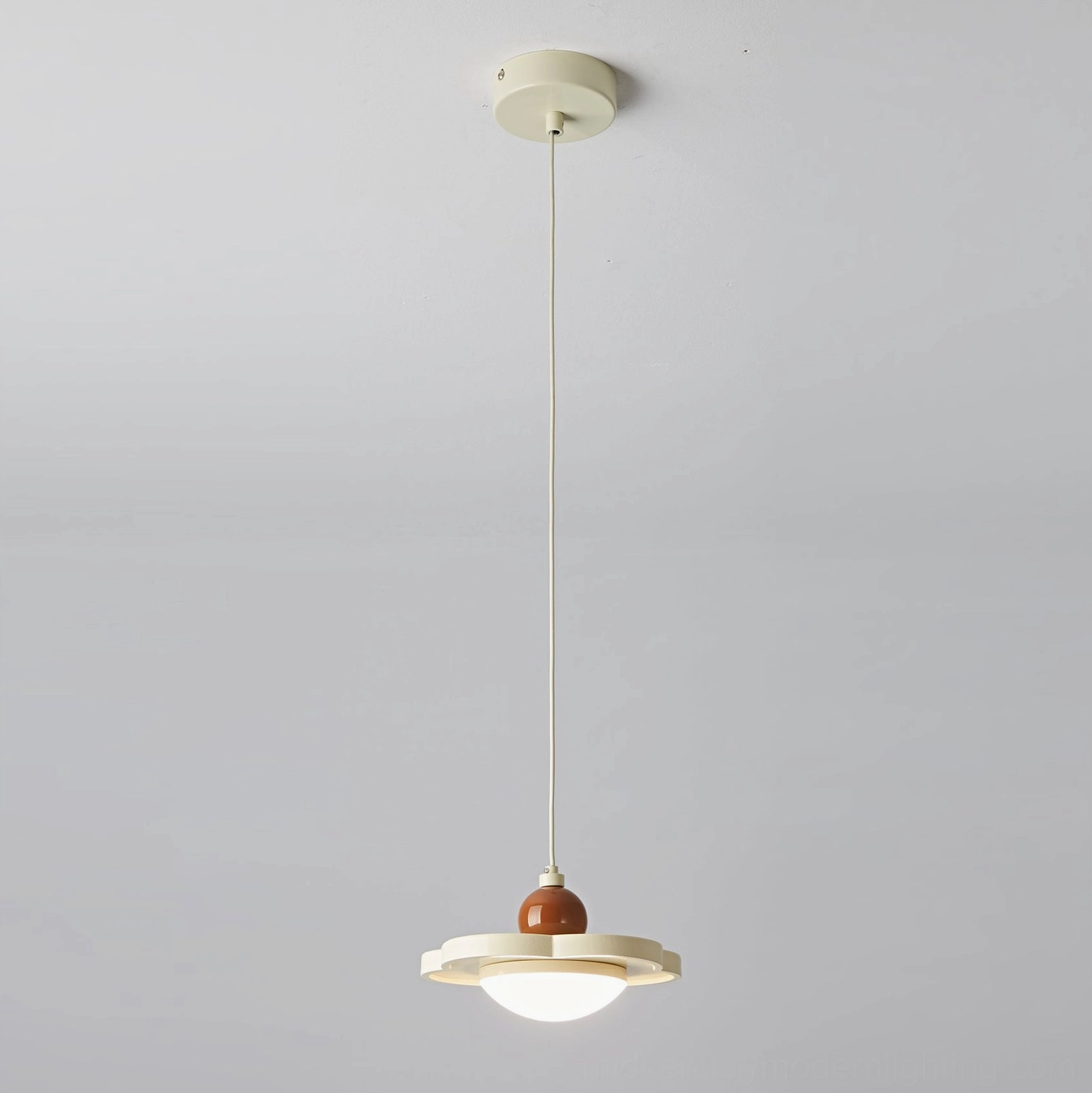 Laguna pendant ceiling light with cream color trim, overhead studio view, minimalist design
