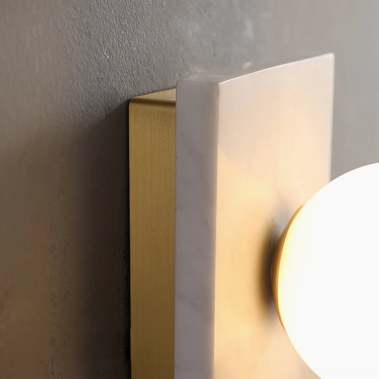 Detailed view of Lan wall sconce glass diffuser showing frosted finish and light diffusion qualities