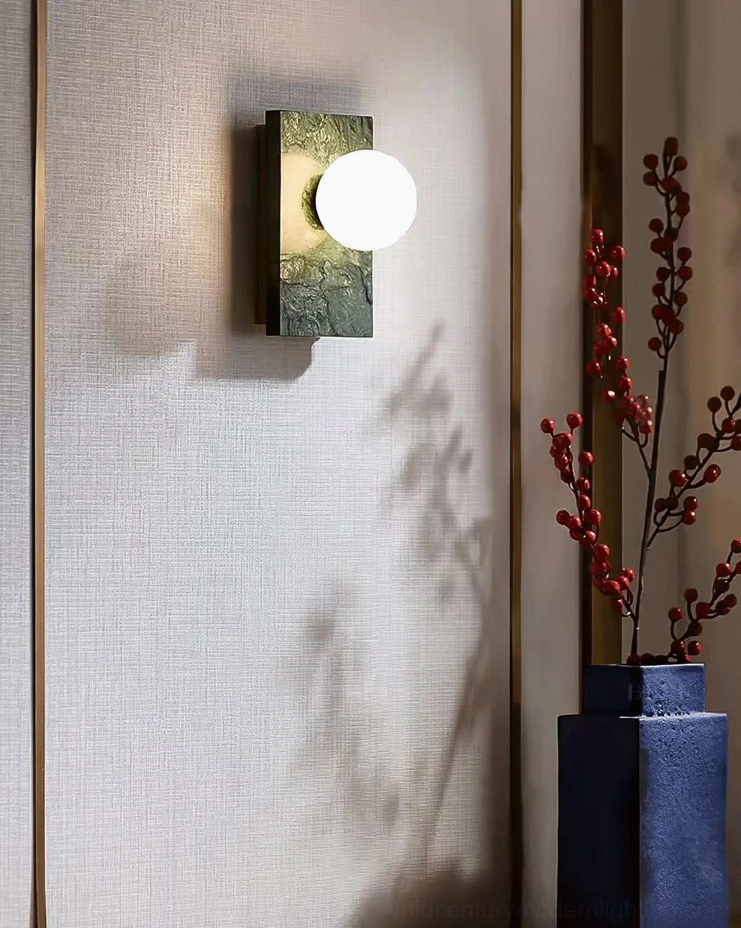 Comparison view of Lan marble wall sconce showing both green and white marble finish options available