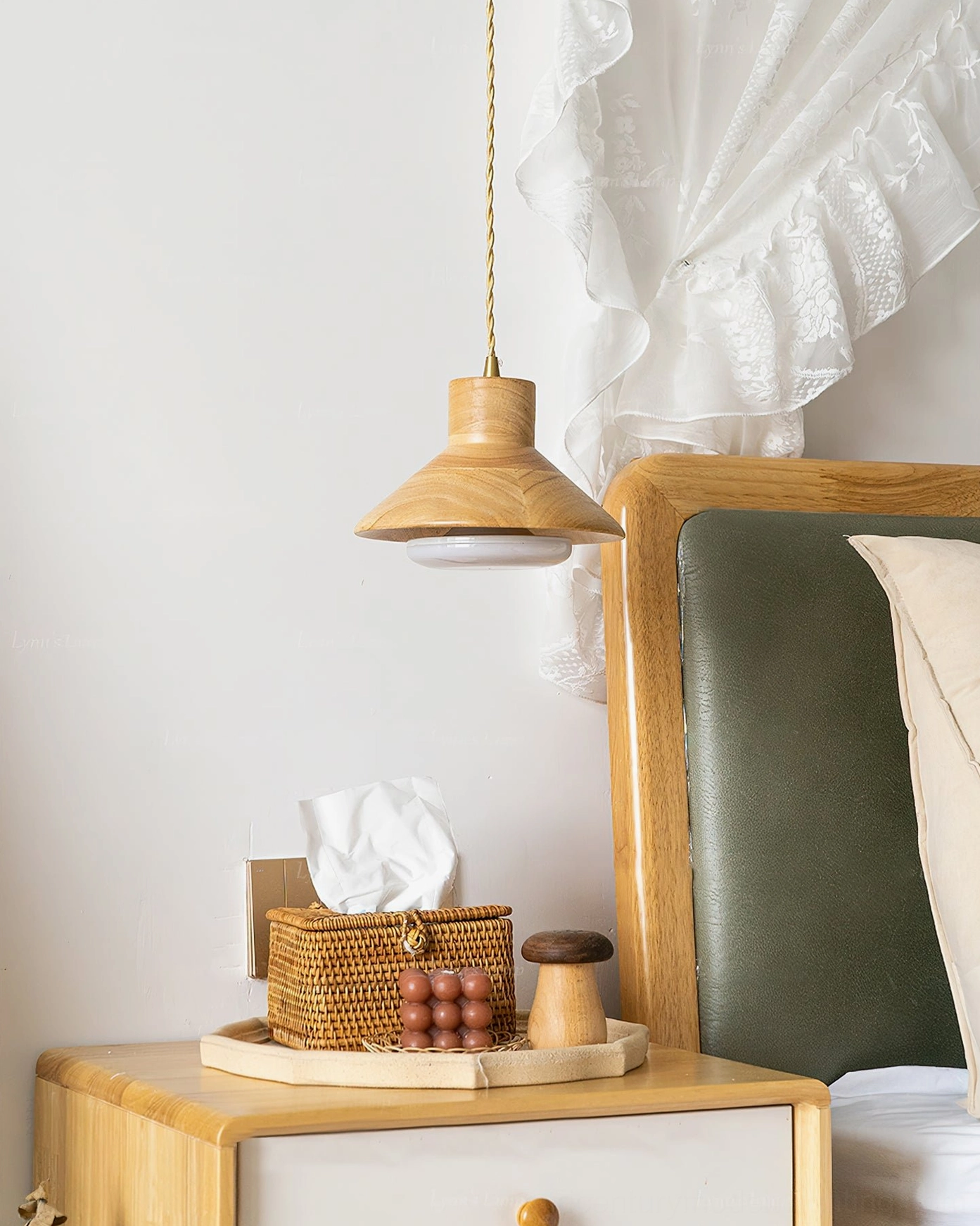 Lander wood pendant fixture above nightstand with wicker tissue box on wooden serving tray