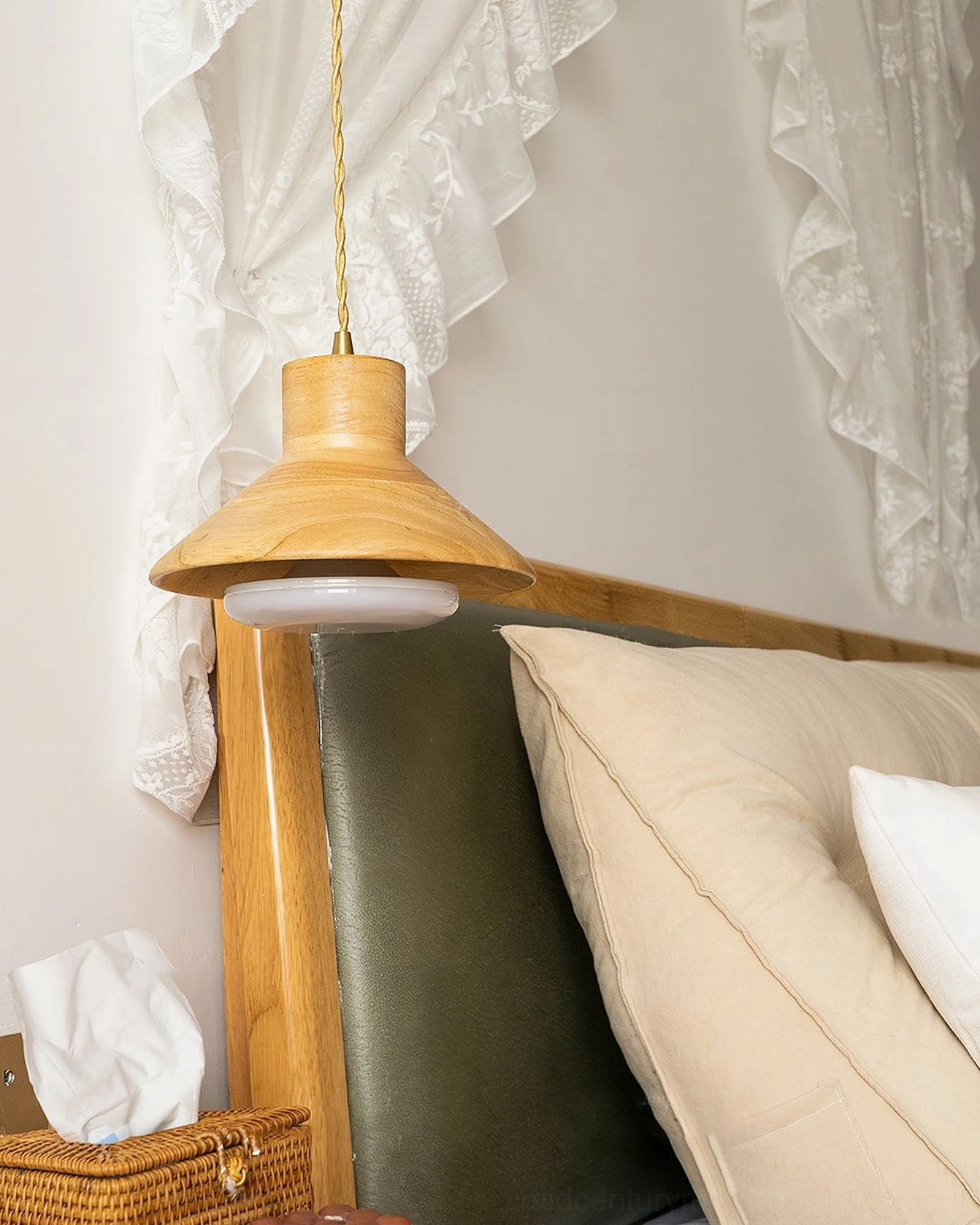 Unlit Lander wood pendant coordinated with wooden bed frame in modern bedroom design