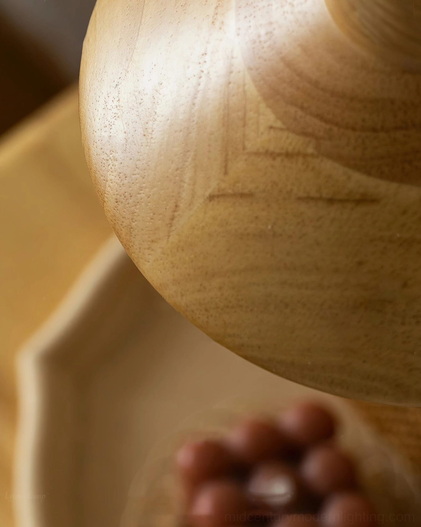 Close-up detail of natural wood grain and brown wooden spherical ornaments with Lander pendant