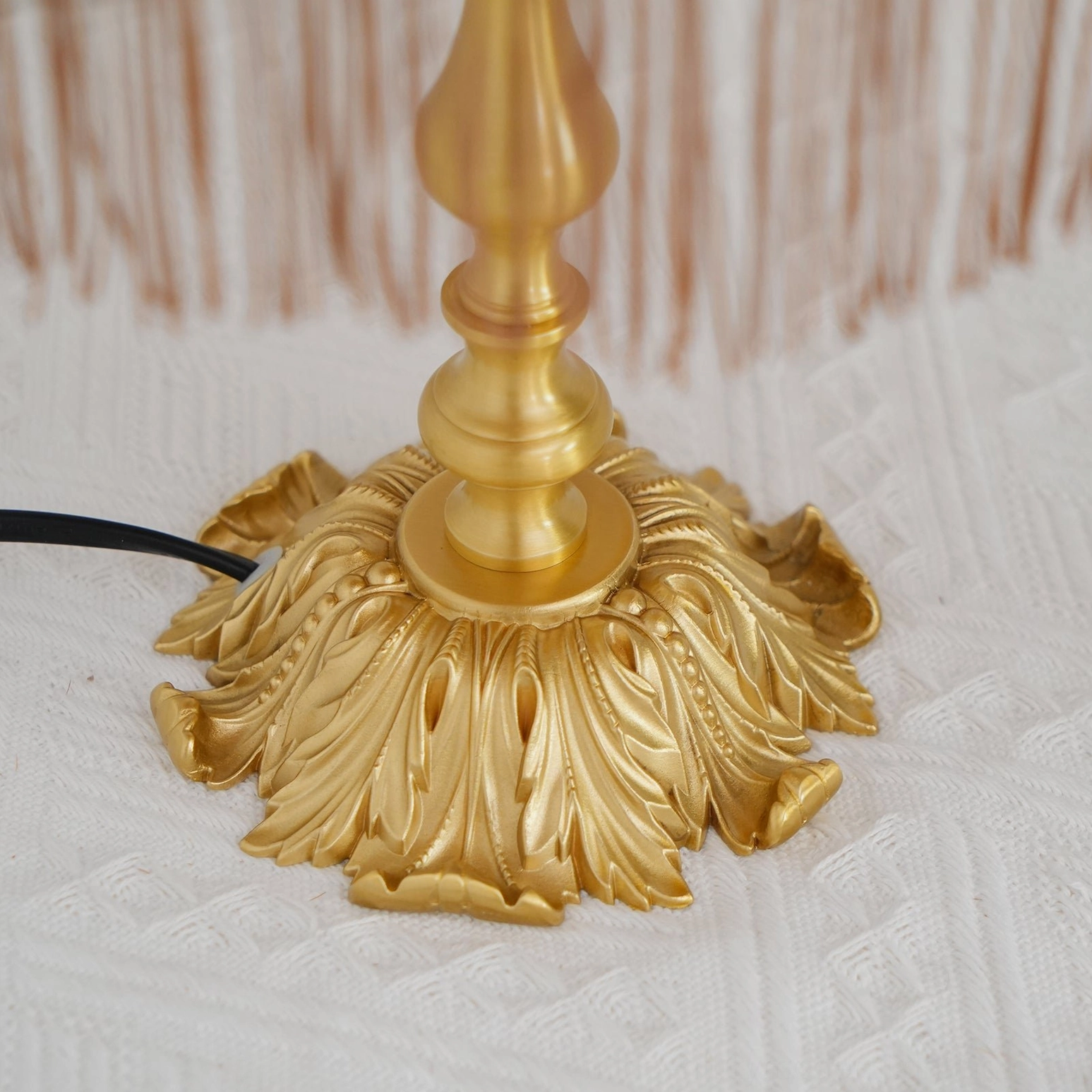 Lanna table lamp detail shot tassel trim red fabric brass base warm lighting fixture