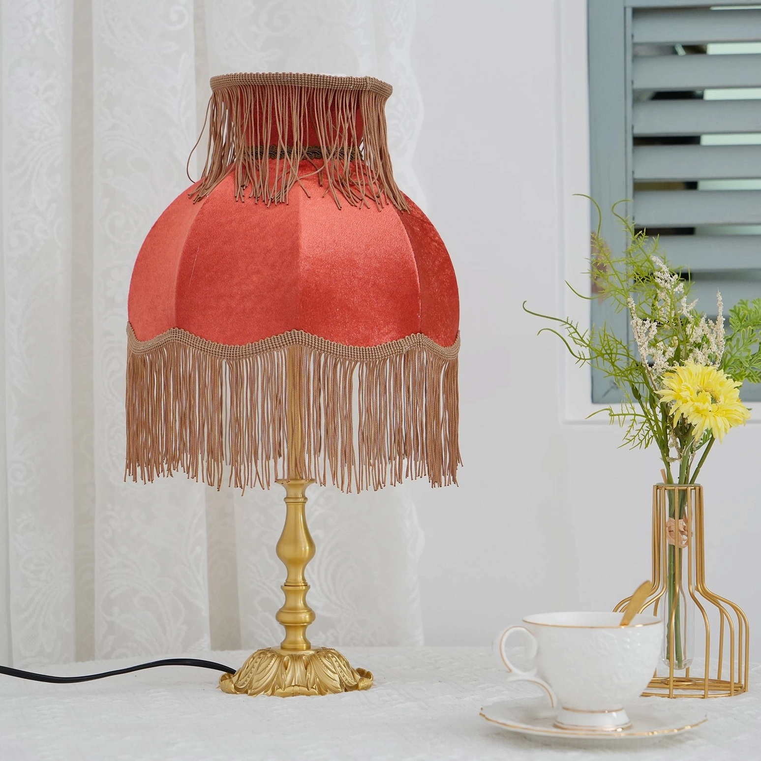 Lanna red tassel table lamp full view brass stem base burgundy fabric shade tassels studio shot