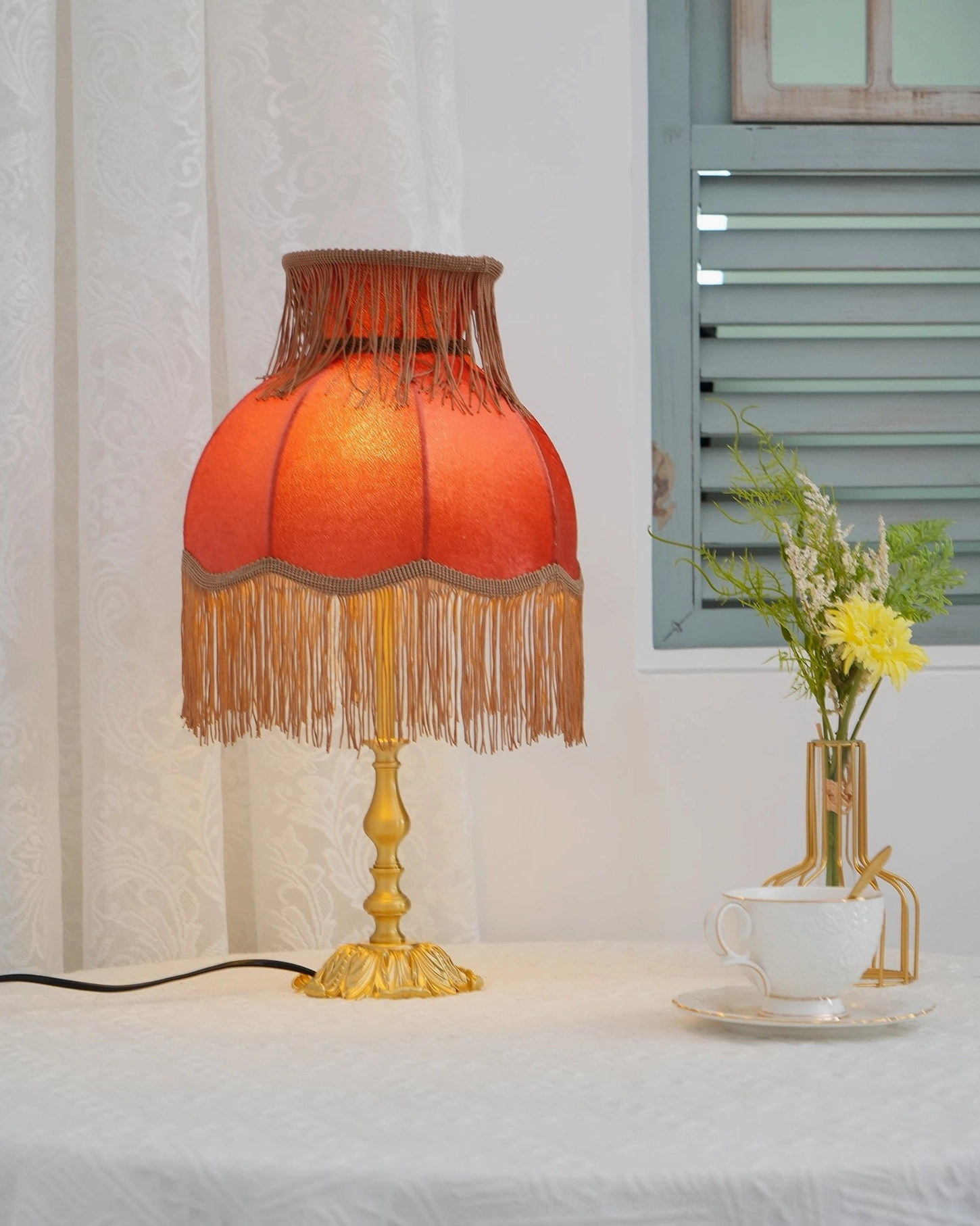 Lanna tassel lamp mid-century modern style wooden cabinet surface brass finish warm interior