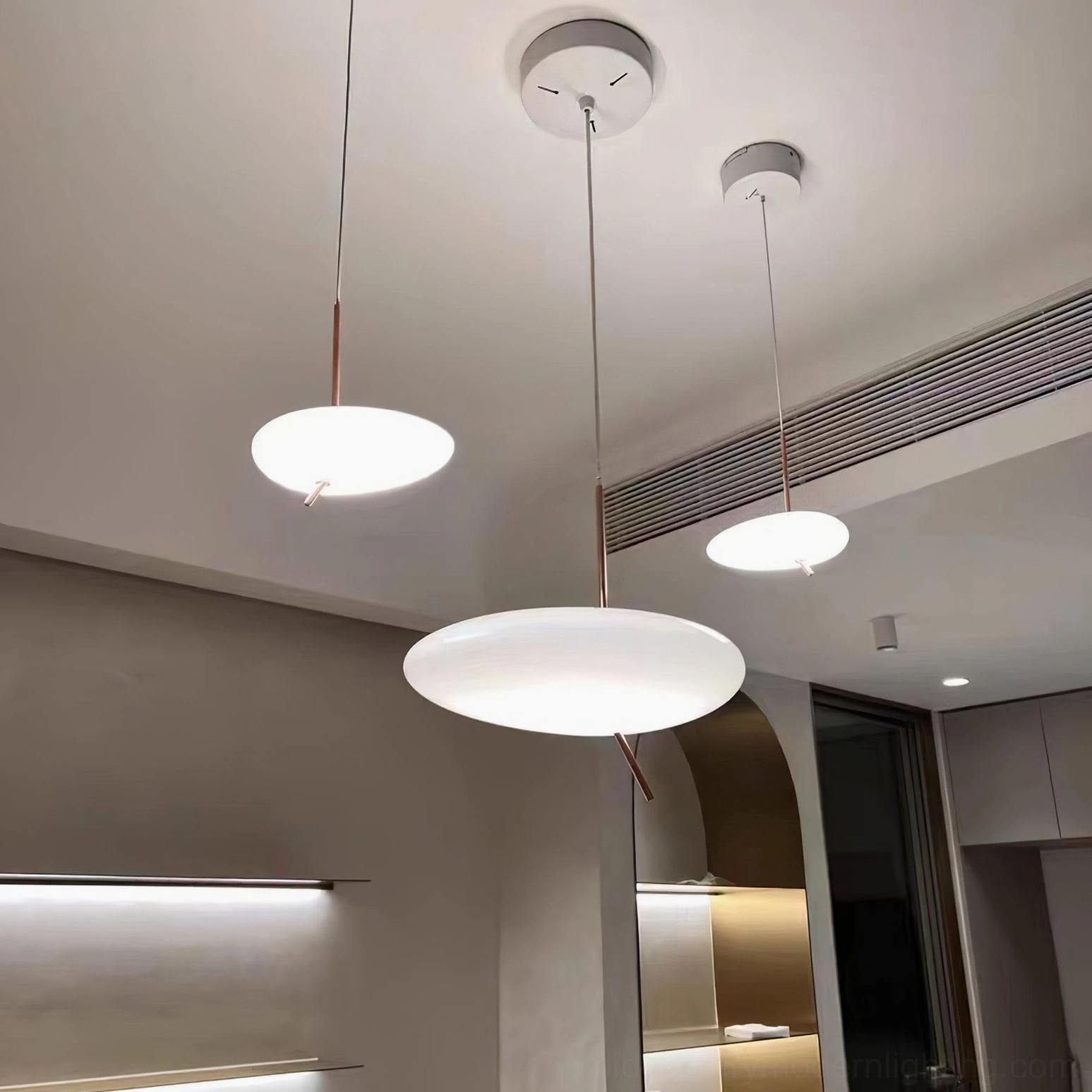 Large size pebbles pendant light installation in open concept kitchen and dining area