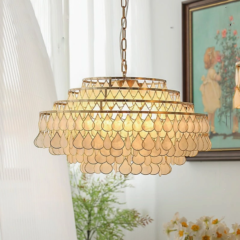 Large tiered shell pendant lamp 60cm diameter, studio view showing scale and craftsmanship of genuine shell construction with gold hardware