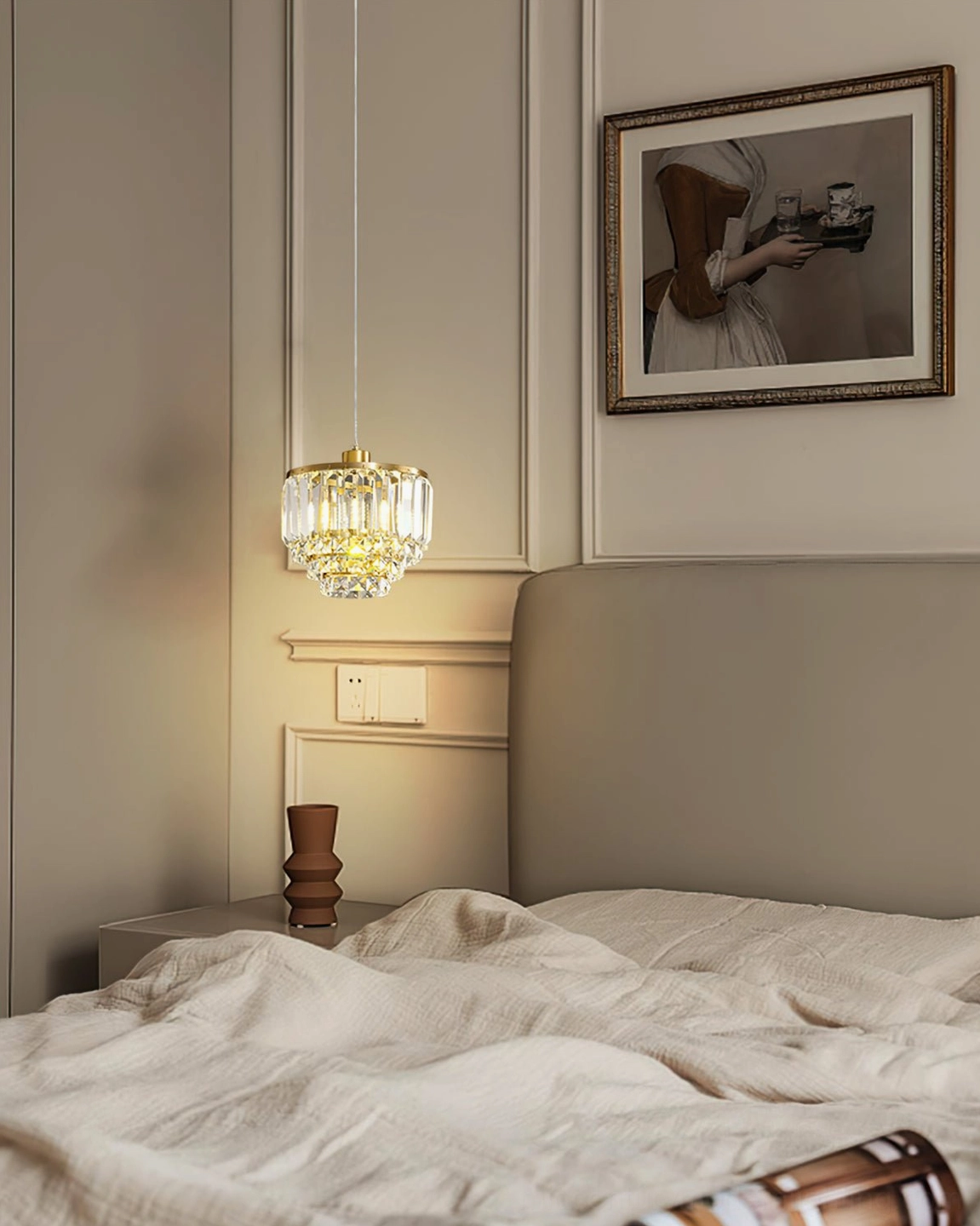 Luxury brass crystal pendant light above master bedroom tufted bed elegant home accent