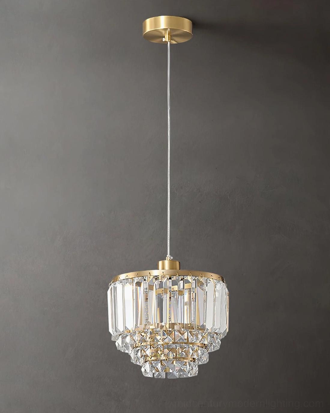 Mid-century modern brass pendant light warm gold tone crystal shade fixture design