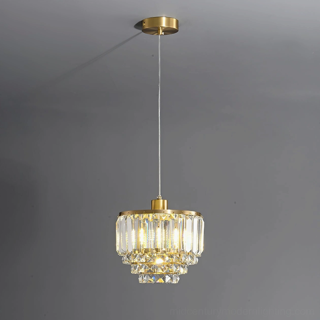 Laura crystal tiered brass pendant light architectural detail close-up faceted crystal construction