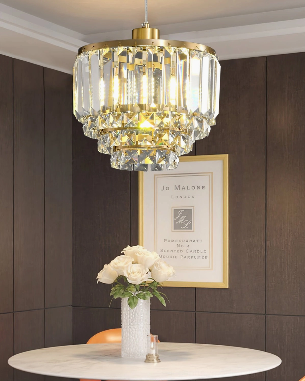 Crystal brass tiered pendant light small dining nook dark wood paneling mid-century decor