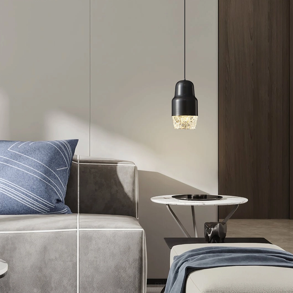 Black matte Lavinia pendant lamp in luxury modern living room with sofa, textured glass shade detail