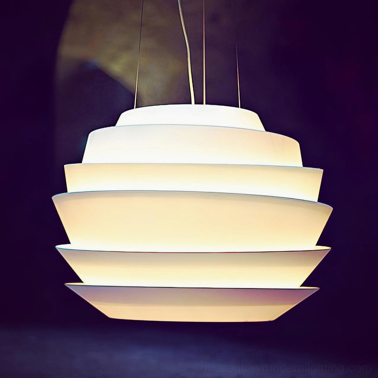 Pendant lamp blue finish interior room setting modern aesthetic tiered design