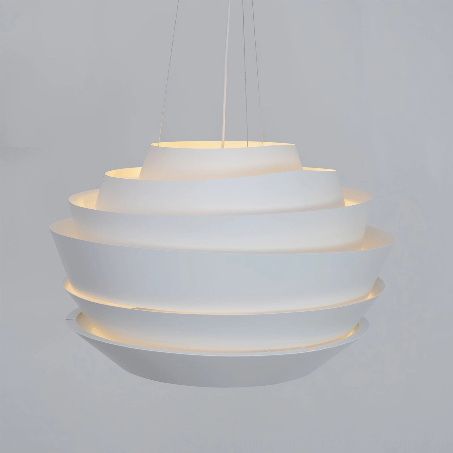 Tiered pendant light overhead perspective warm ambient glow interior lighting design