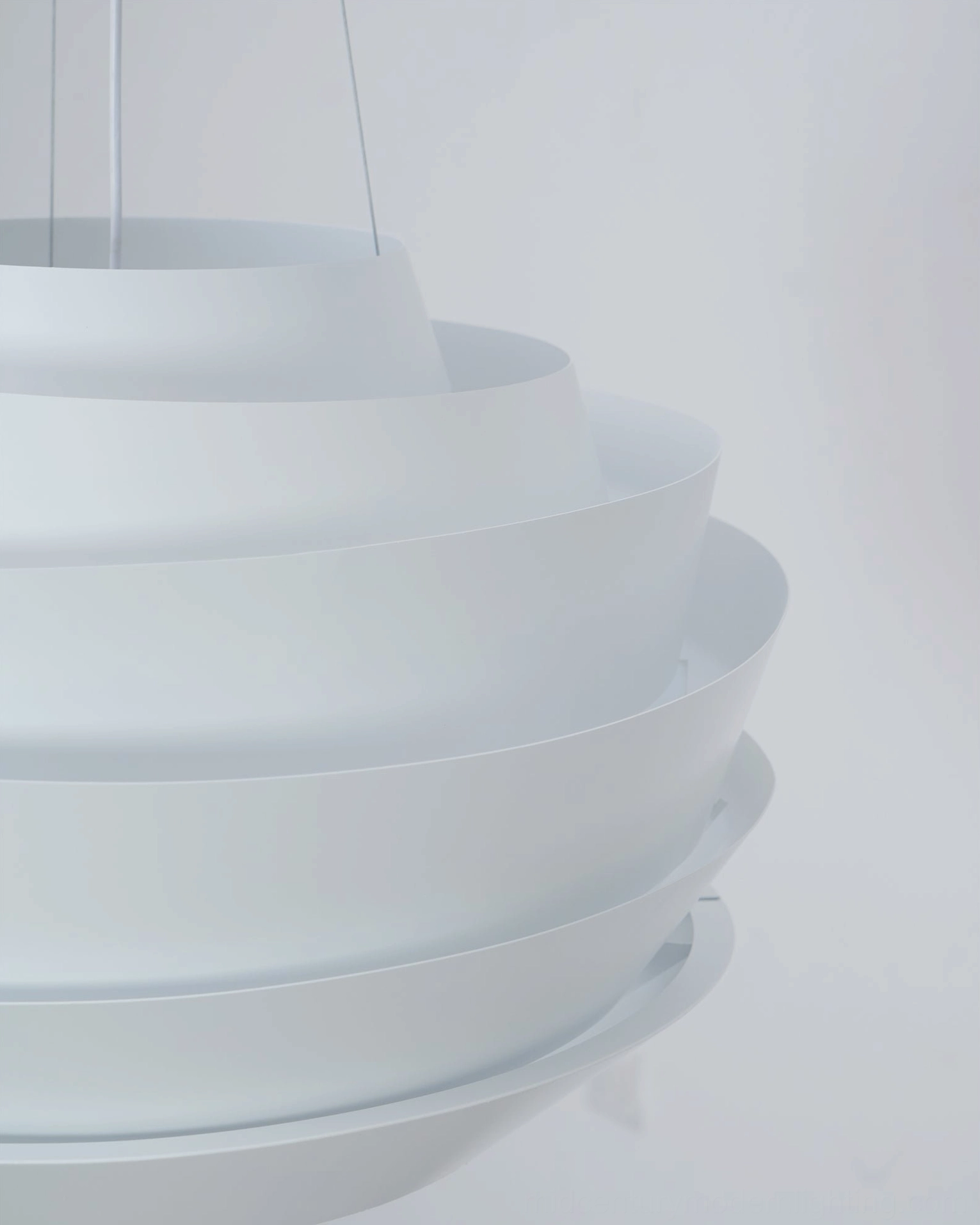 Side close-up view stacked curved white tiers suspension cord pendant lamp