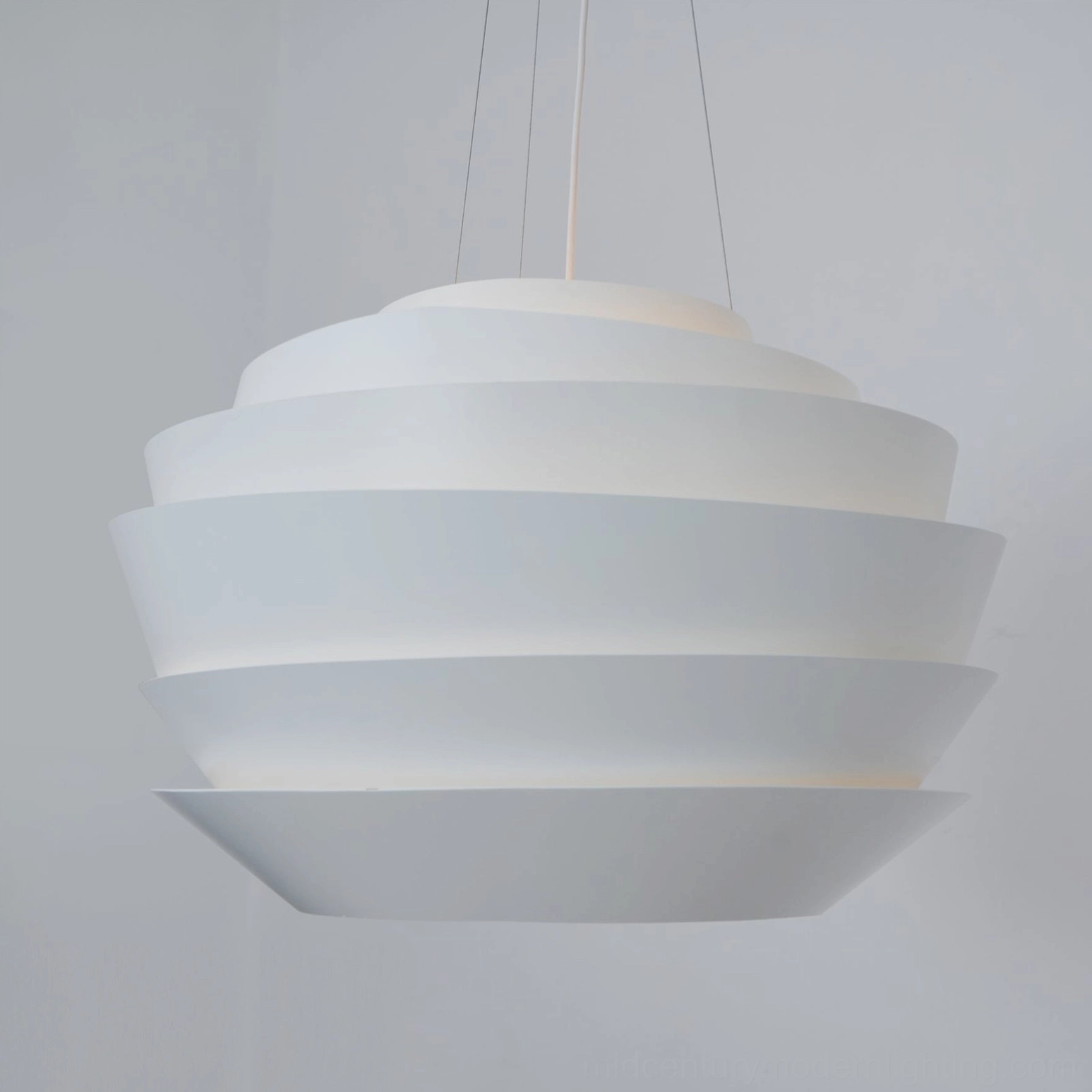 Pendant lamp side profile curved staggered tiered white architecture lighting