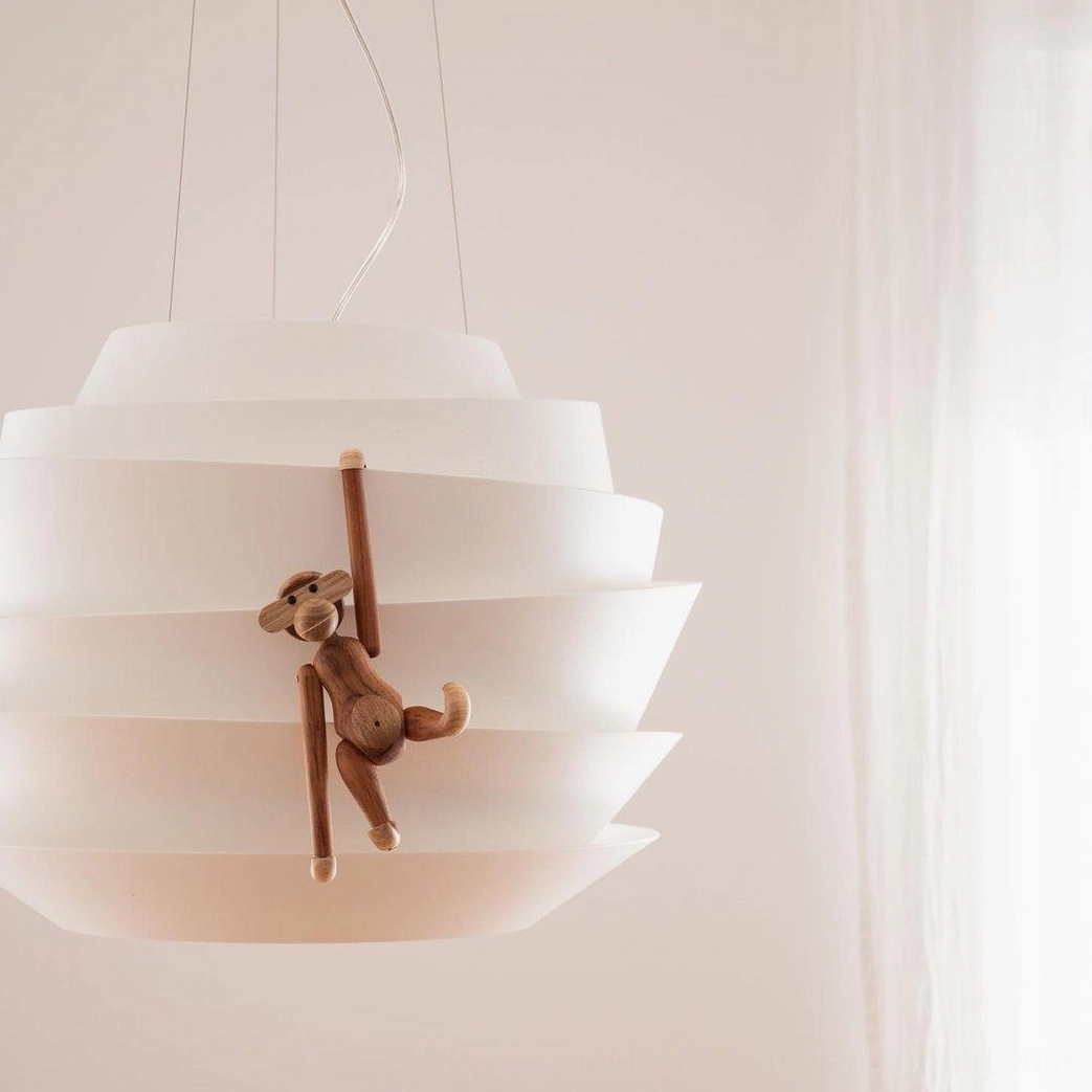 Sunburst pendant lamp close-up surface detail matte white finish quality material
