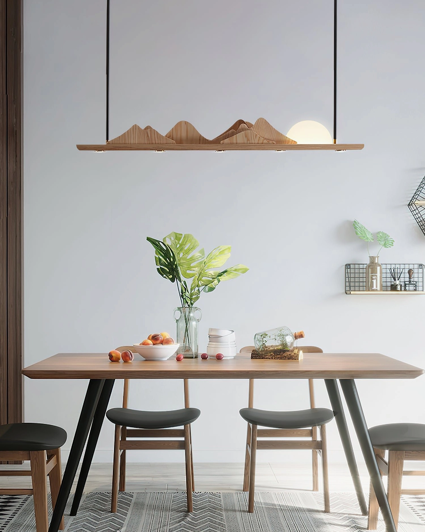 Contemporary dining room with Leah Mountains 47-inch linear pendant – minimalist tablescape with plants and tableware