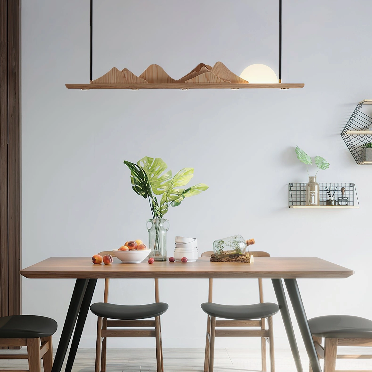Leah Mountains mountain ridge dining pendant – installed above warm wood dining table with minimalist place settings and natural light
