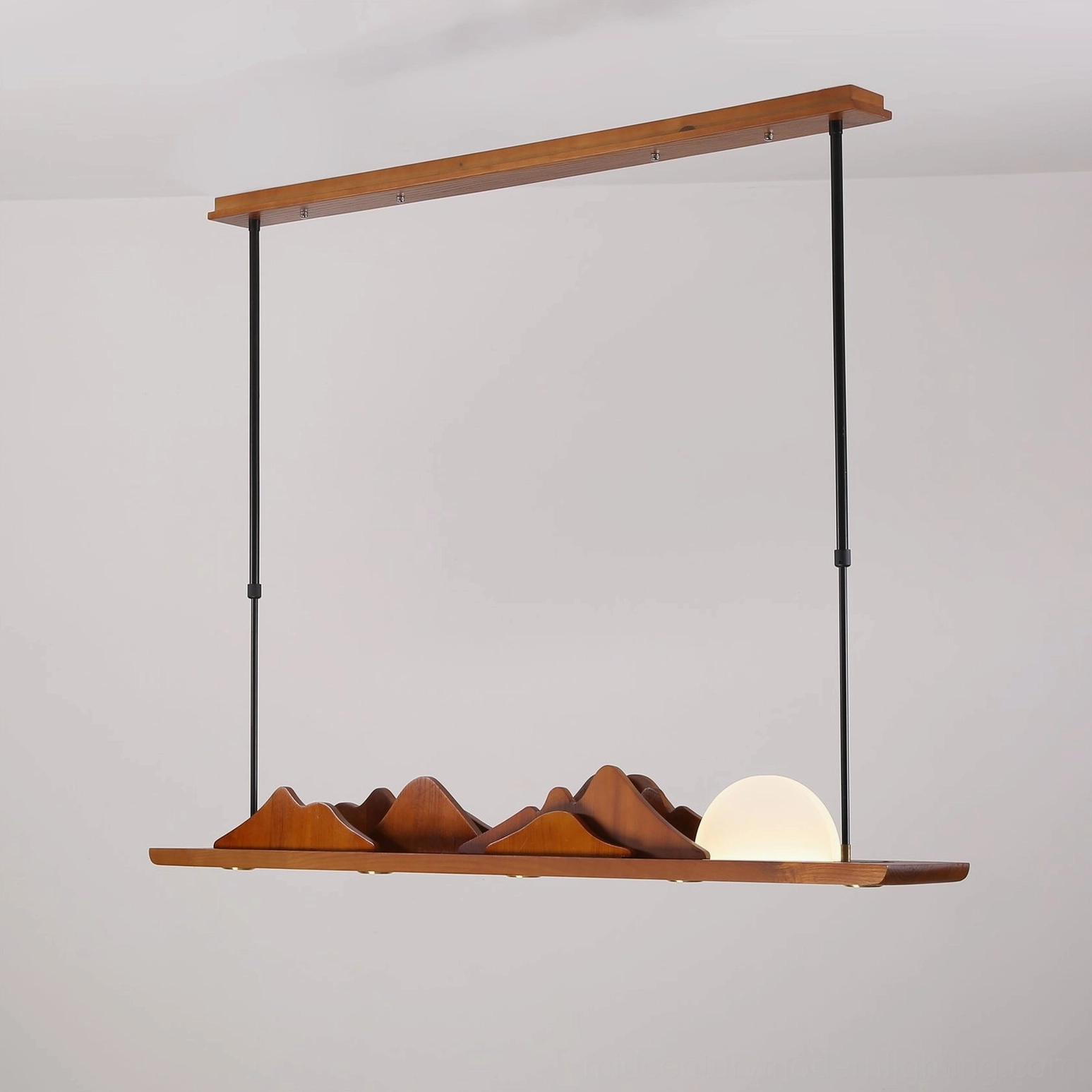 Leah Mountains 47-inch sculptural pendant light – three-quarter view in studio lighting showing full ridge and hemisphere form