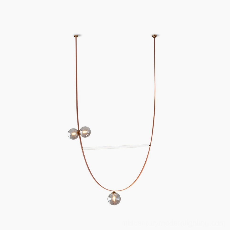 Brown leather strap sculptural ball pendant chandelier with smoked glass spheres and linear LED lights in minimalist modern design