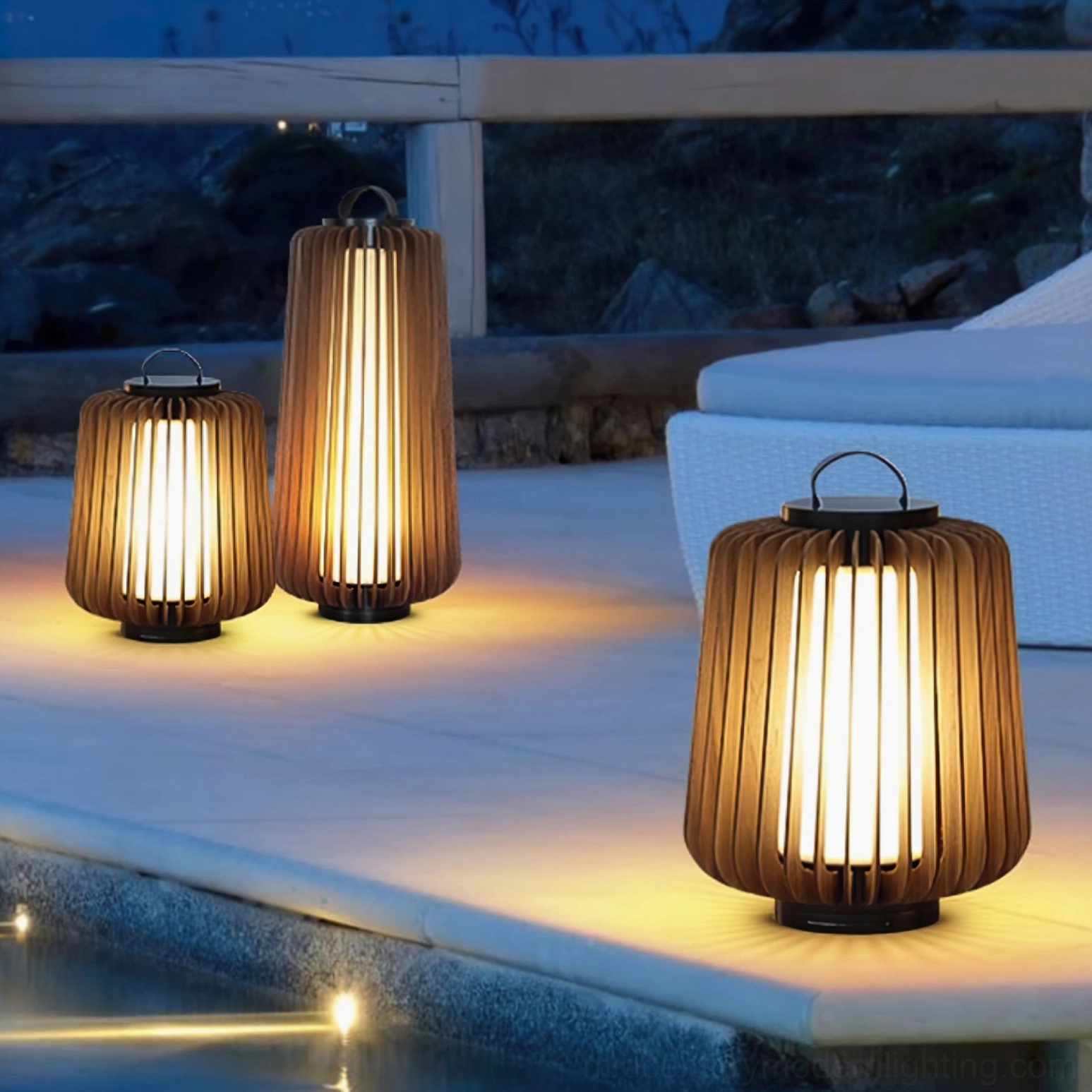 Set of Legno wooden outdoor lantern lamps creating warm ambient poolside lighting at night