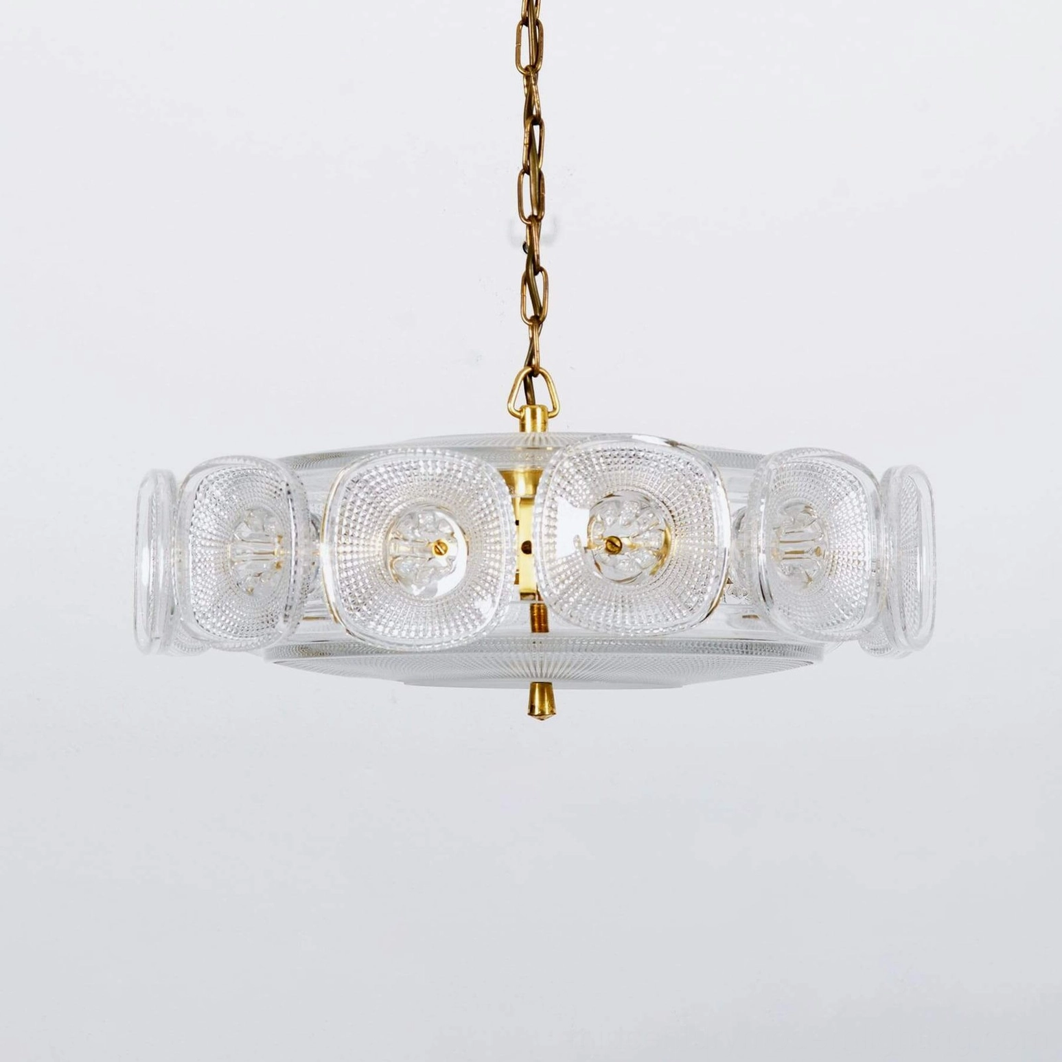 Lennox clear glass ring chandelier gold brass hardware overhead studio photography