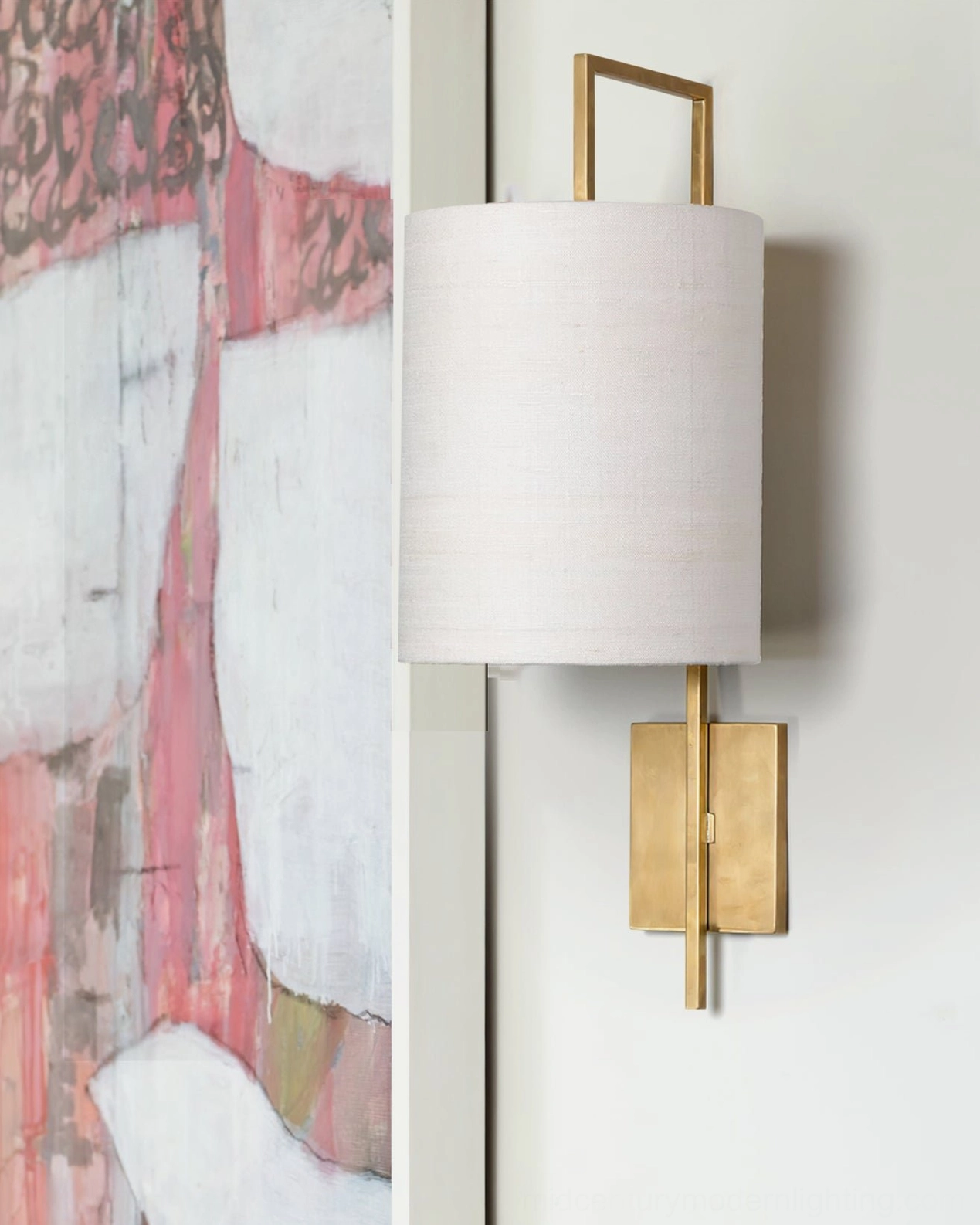 Lewes brass wall light with fabric shade in modern interior setting