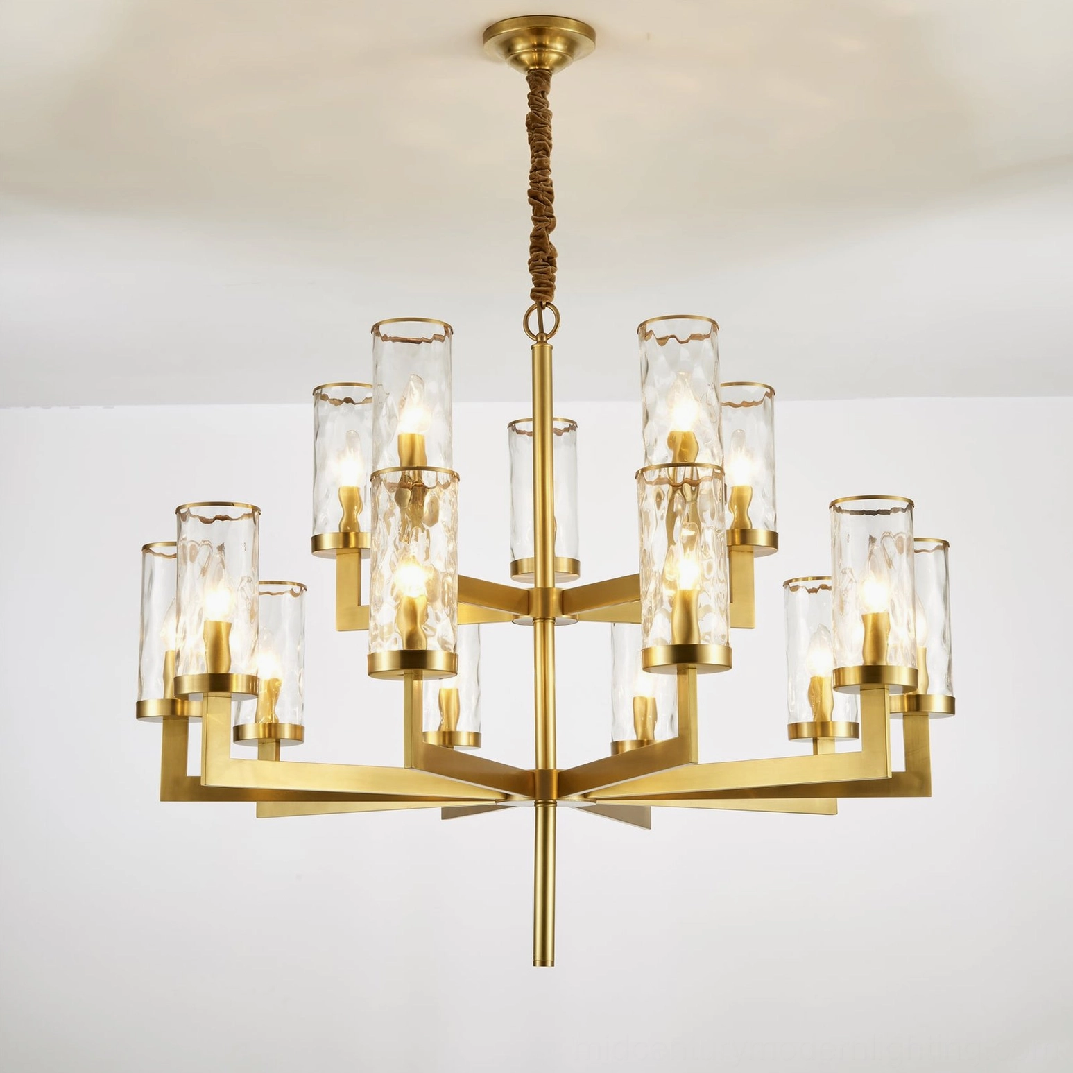 Liaison brass glass chandelier creating ambient atmosphere in residential interior