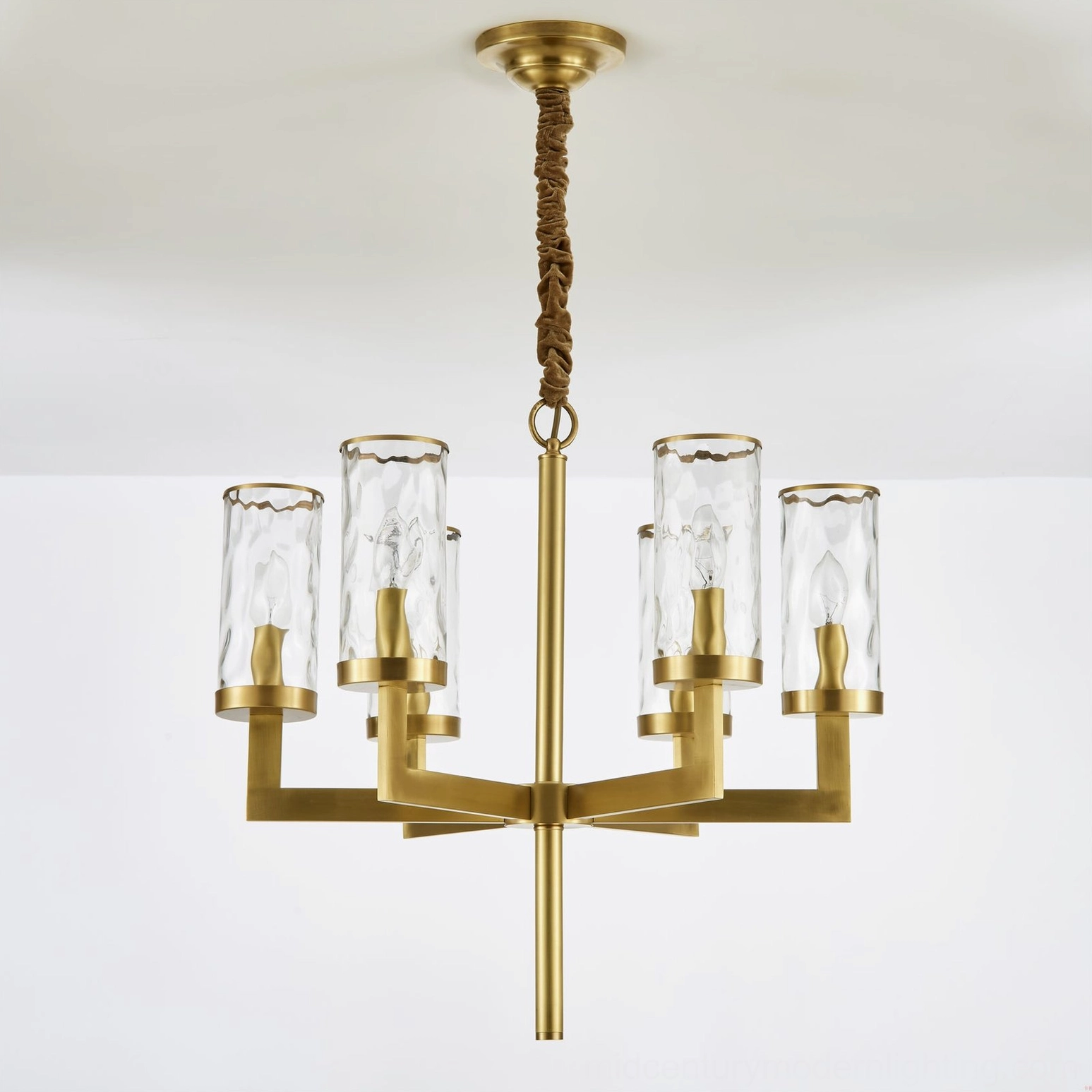 Close-up of Liaison chandelier glass shade craftsmanship and brass frame junction