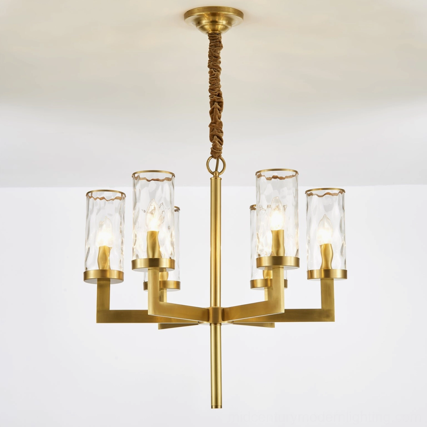 Close-up detail of Liaison chandelier with warm Edison bulbs and twisted brass suspension rod