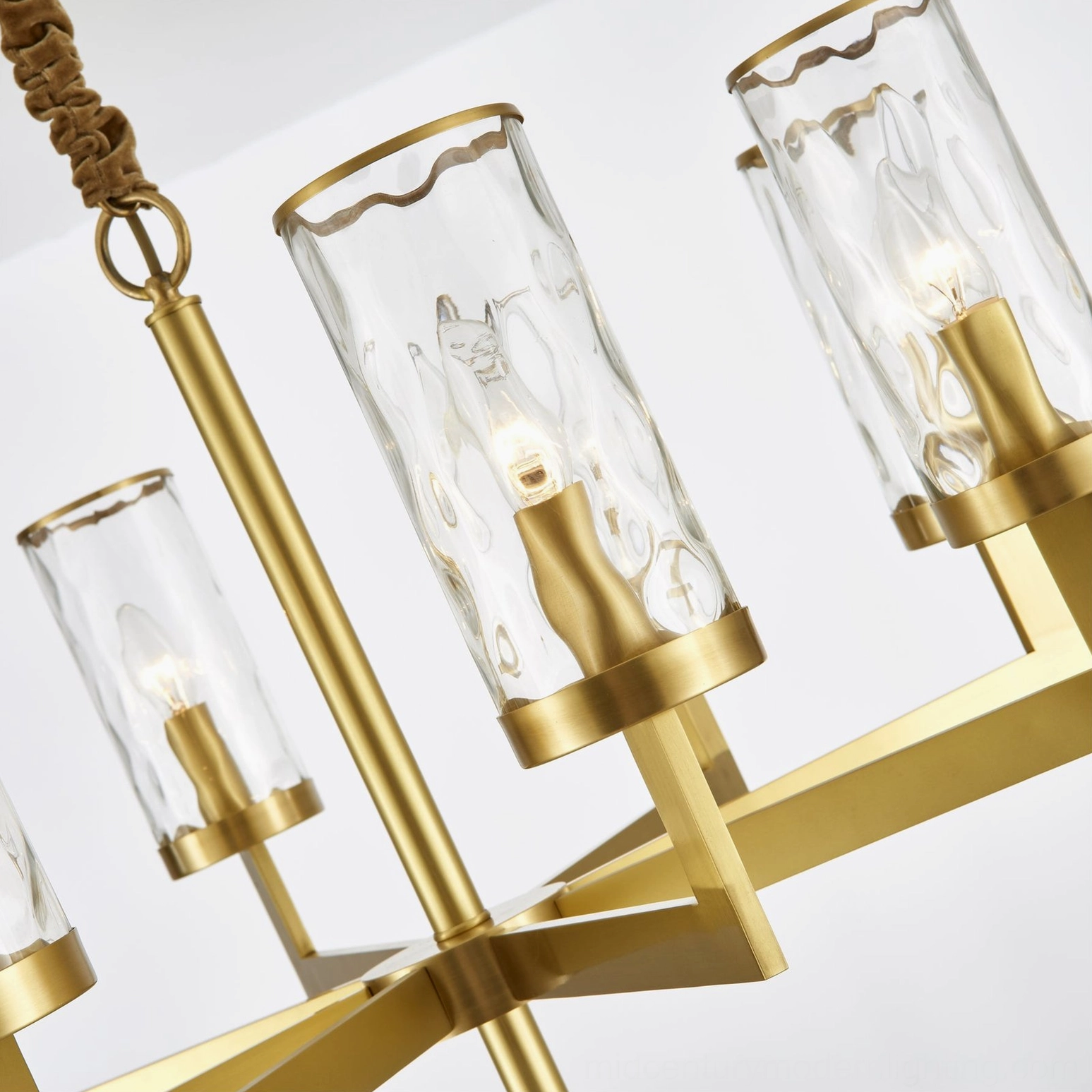 Liaison mid-century chandelier illuminated showing warm light through glass shades