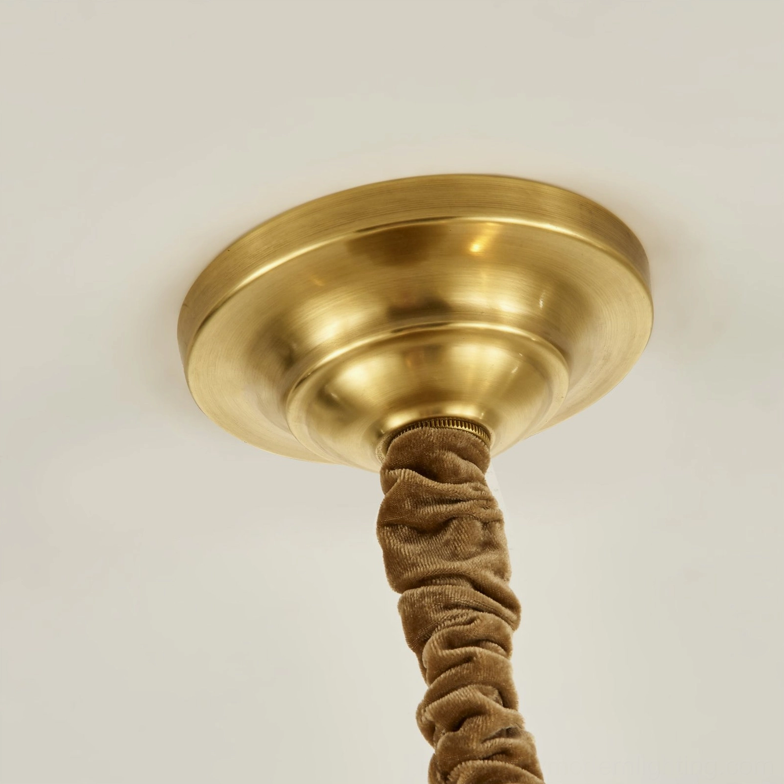 Liaison brass chandelier hanging in elegant interior demonstrating scale and proportion