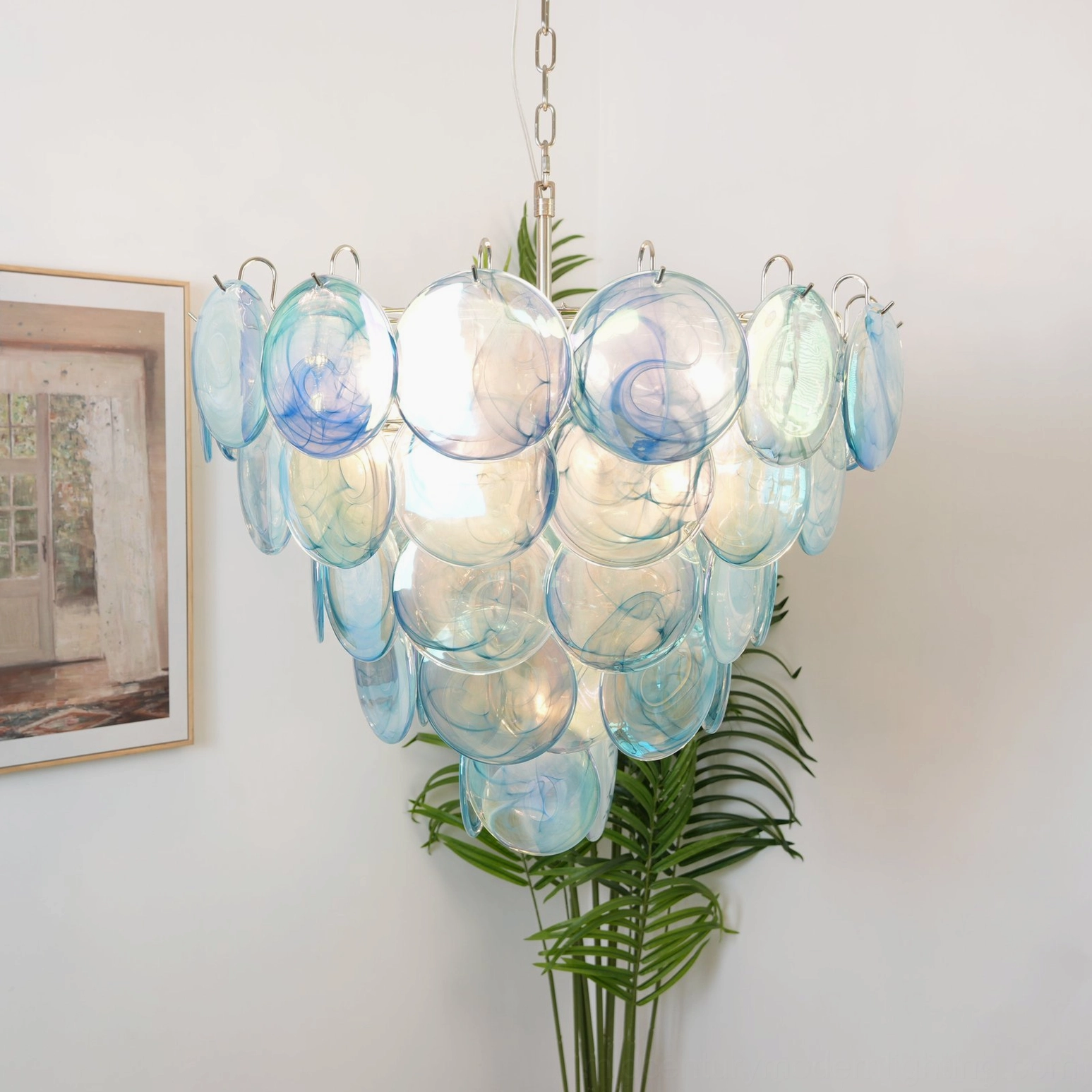 Light blue Murano disc chandelier with clear tinted glass, direct frontal view in contemporary home environment