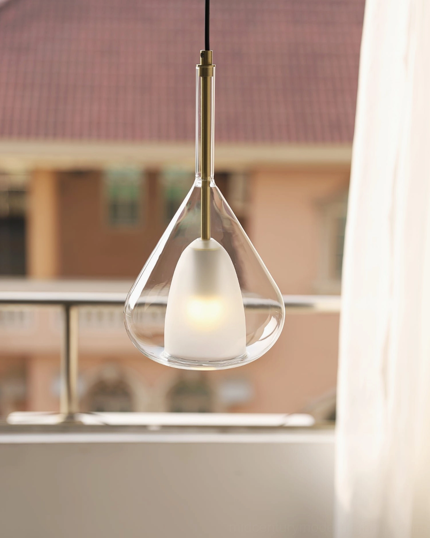 Lila pendant light on residential balcony with natural outdoor daylight and architectural framing