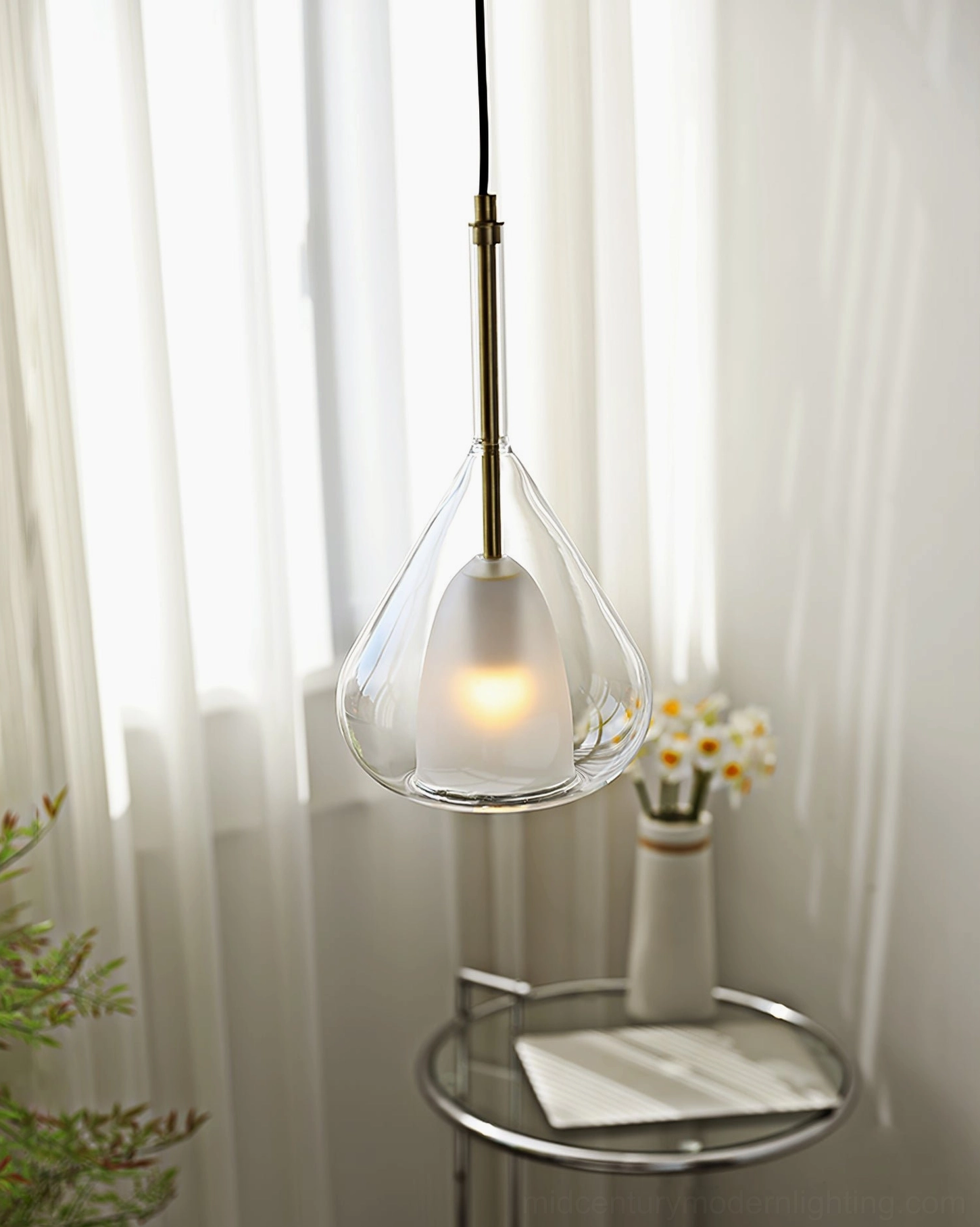 Lila teardrop pendant suspended from ceiling showing metal mounting hardware and wire suspension