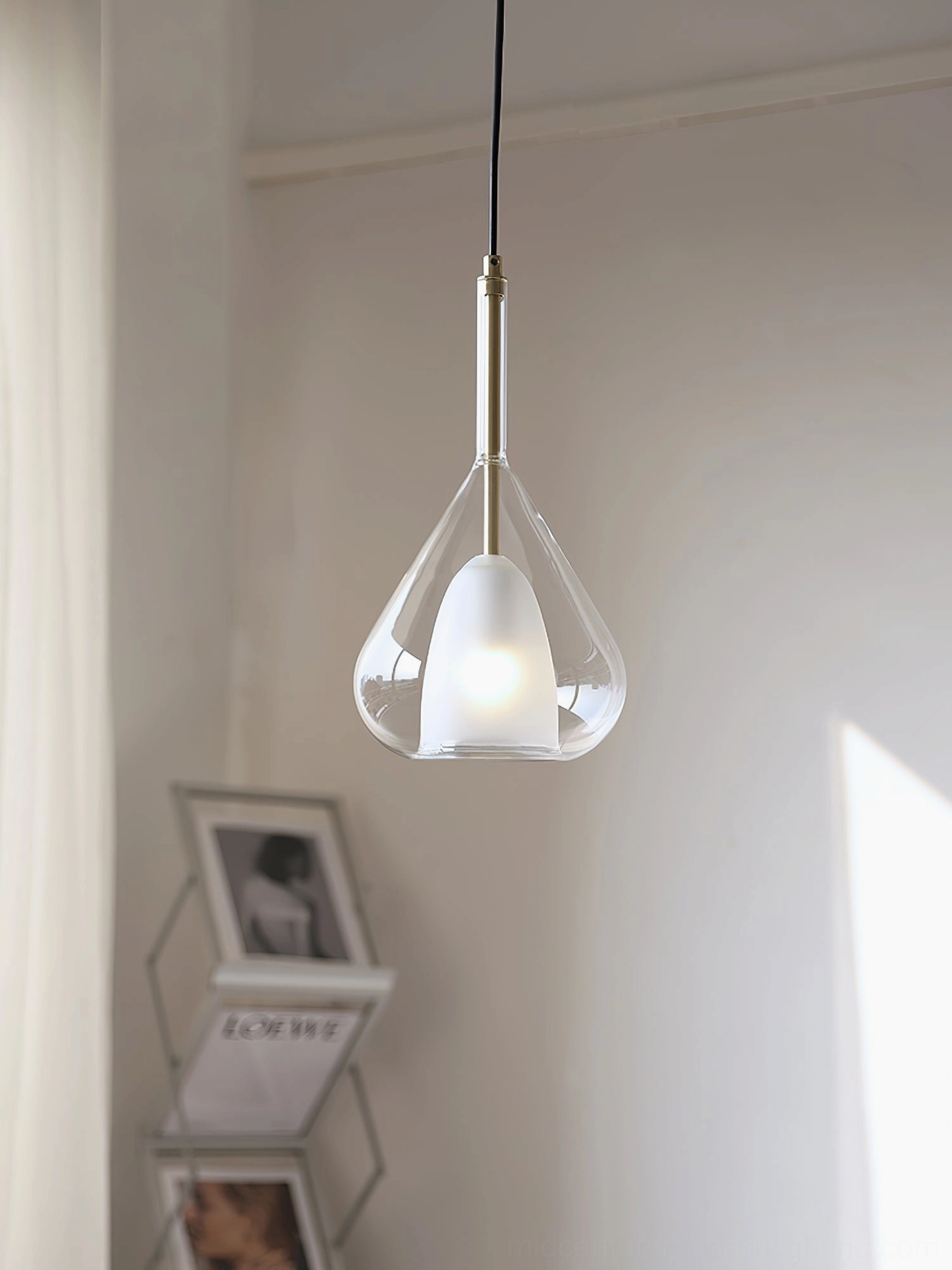 Lila teardrop pendant in minimalist corner space with wall shelves and neutral home decor styling