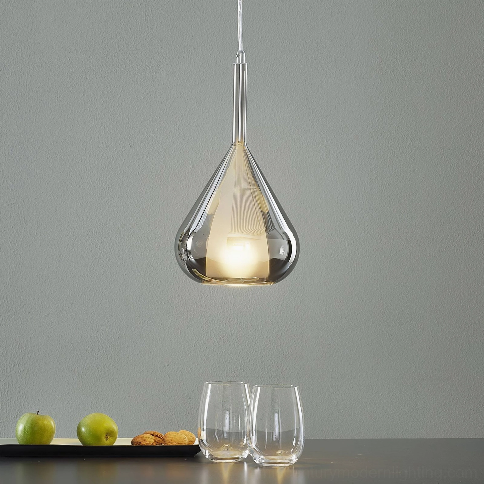 Lila pendant in smoke grey glass creating sophisticated depth and contemporary ambiance