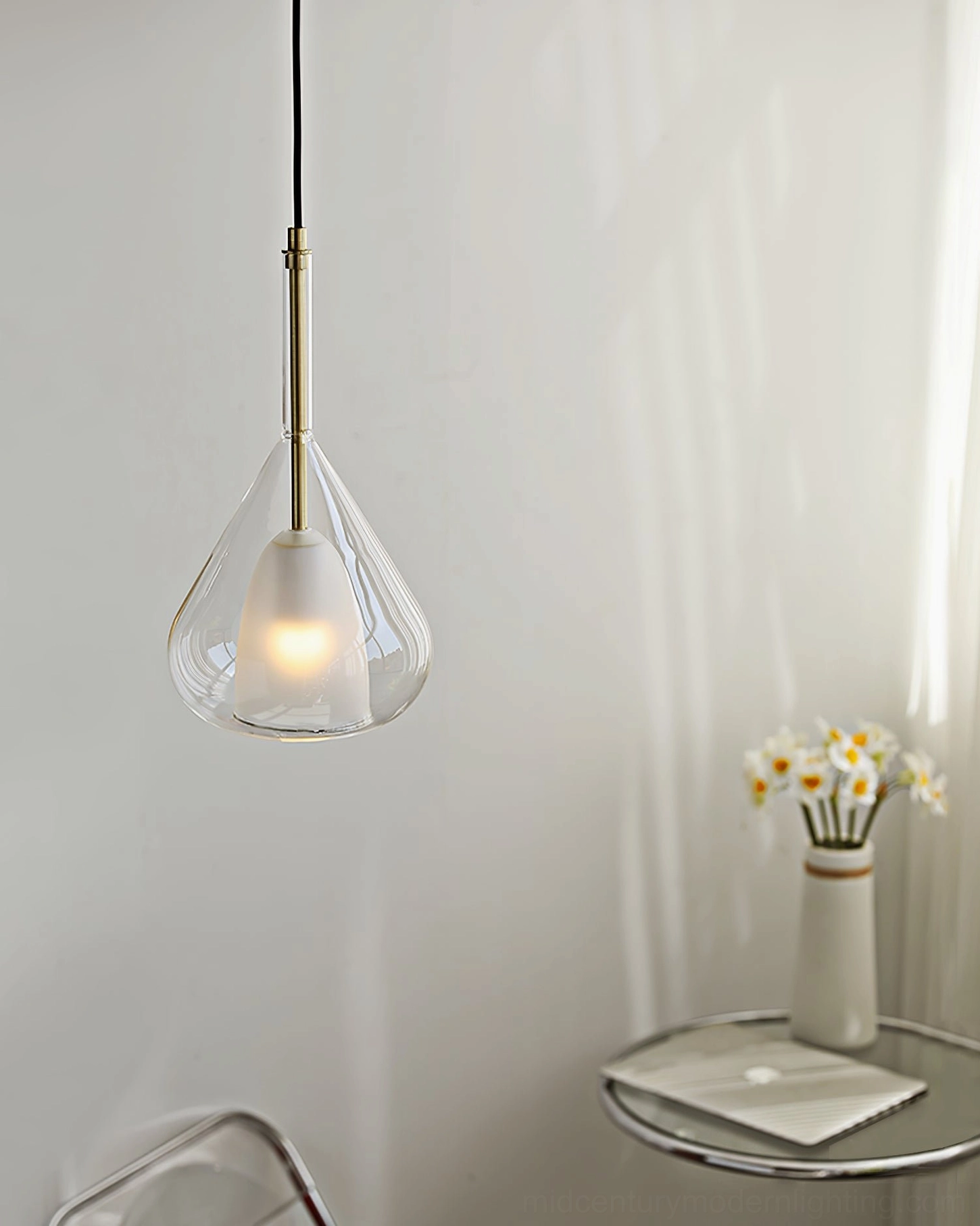 Lila pendant light showing teardrop silhouette against interior architectural background